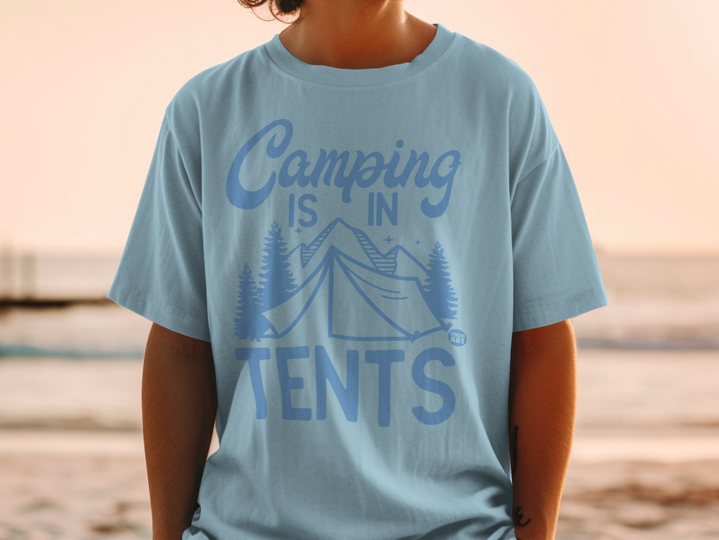 Light blue t-shirt with "Camping is in tents" text and mountain graphic.