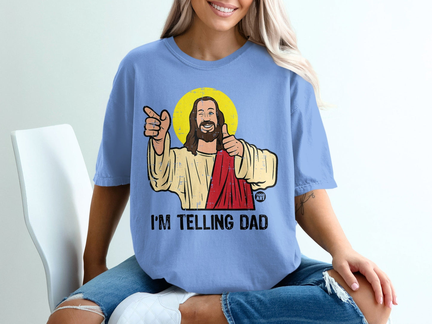 T-shirt with illustration of Jesus giving thumbs up and pointing.