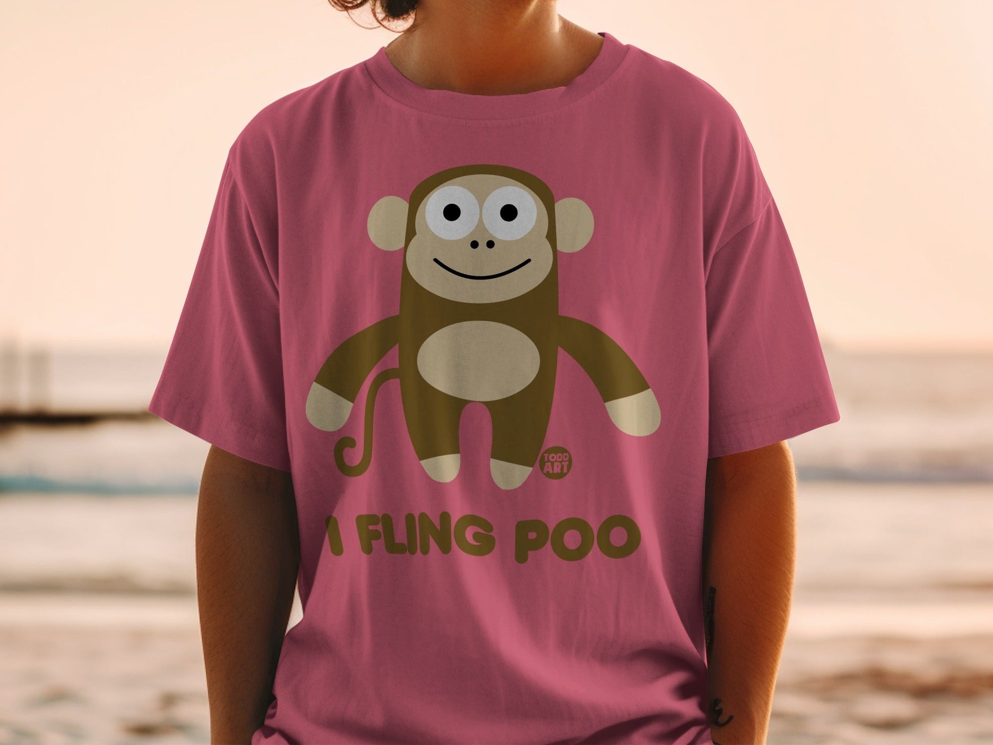 Pink t-shirt with cartoon monkey and text "A FLING POO".