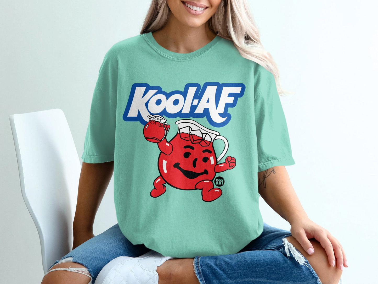 Teal t-shirt with Kool-Aid Man cartoon and "Kool-AF" text.