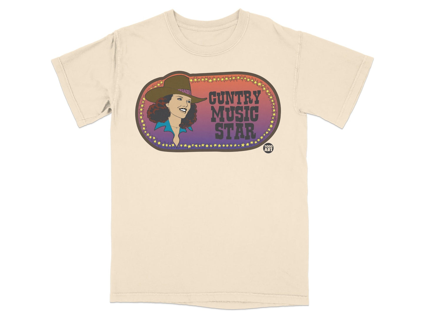 Country Music Star text and woman in cowboy hat on cream t-shirt.