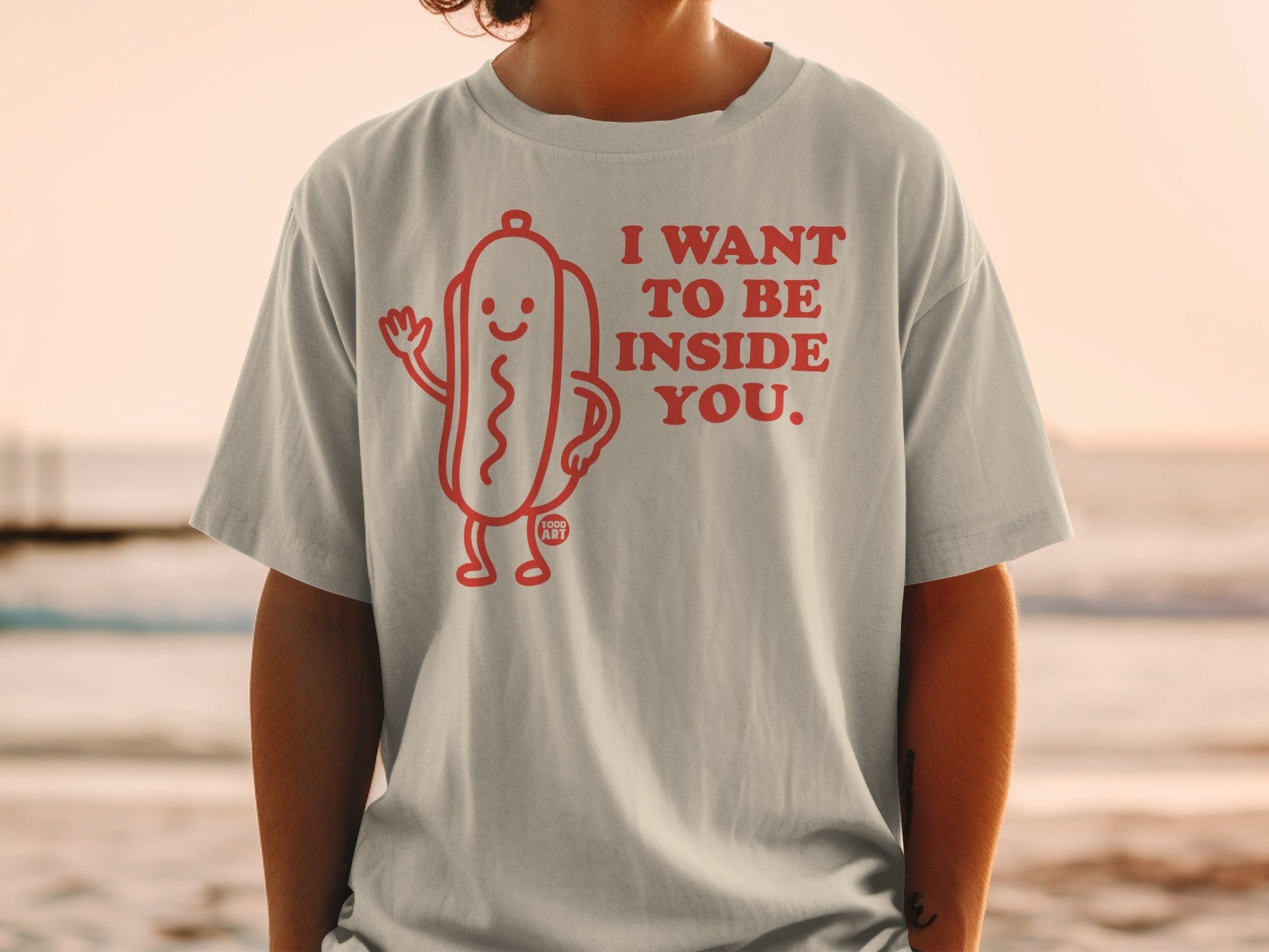 T-shirt with a hot dog graphic and text "I want to be inside you."