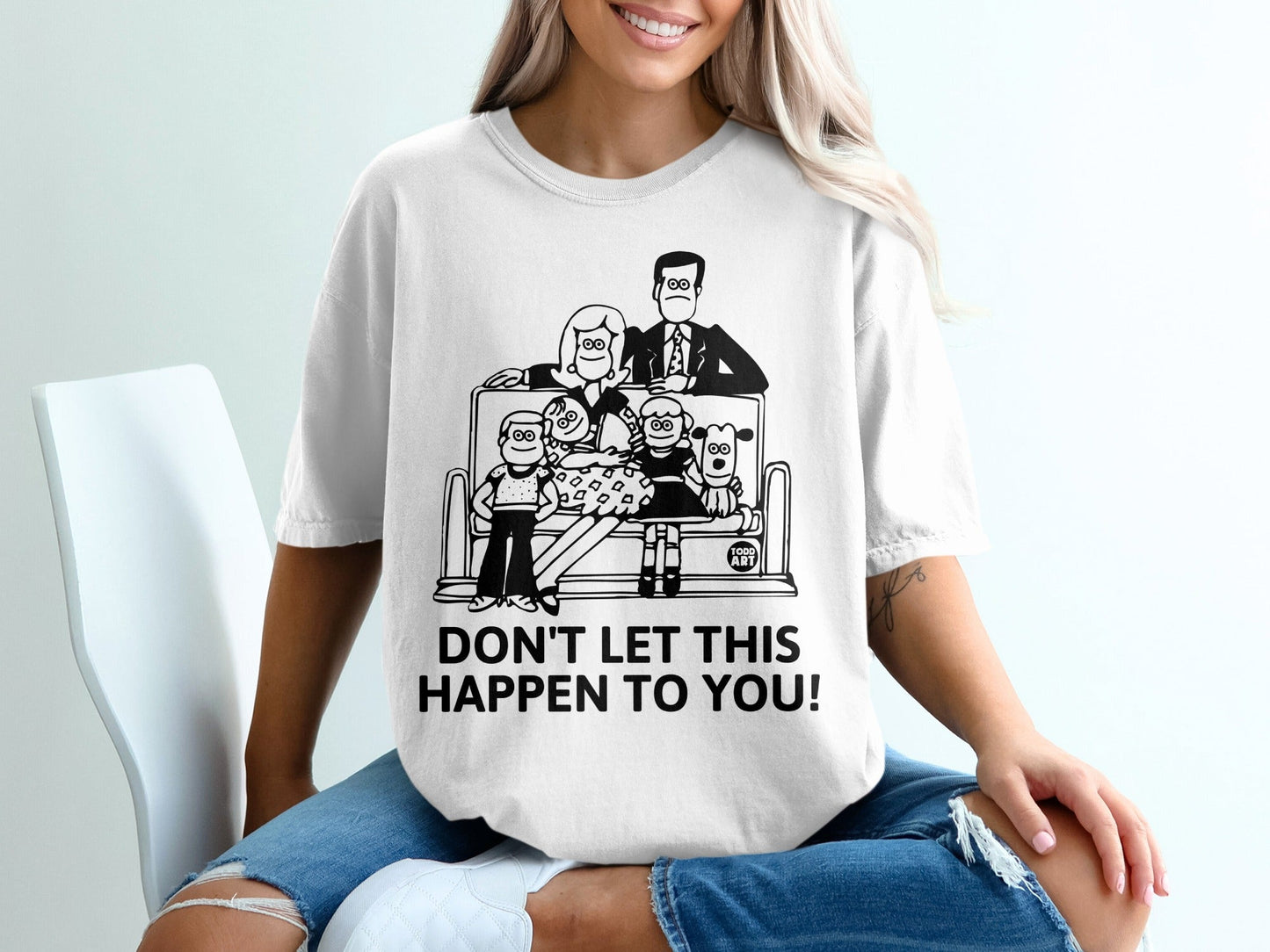 T-shirt graphic of a distressed family on a roller coaster with text "DON'T LET THIS HAPPEN TO YOU!".