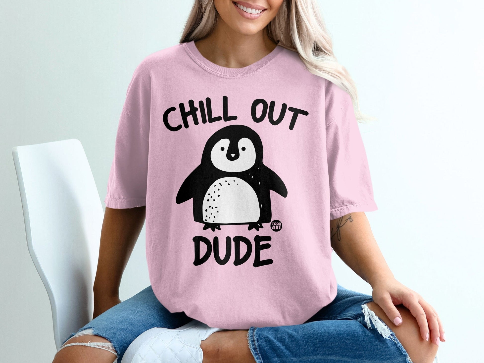 Pink t-shirt with "CHILL OUT DUDE" and a cartoon penguin.