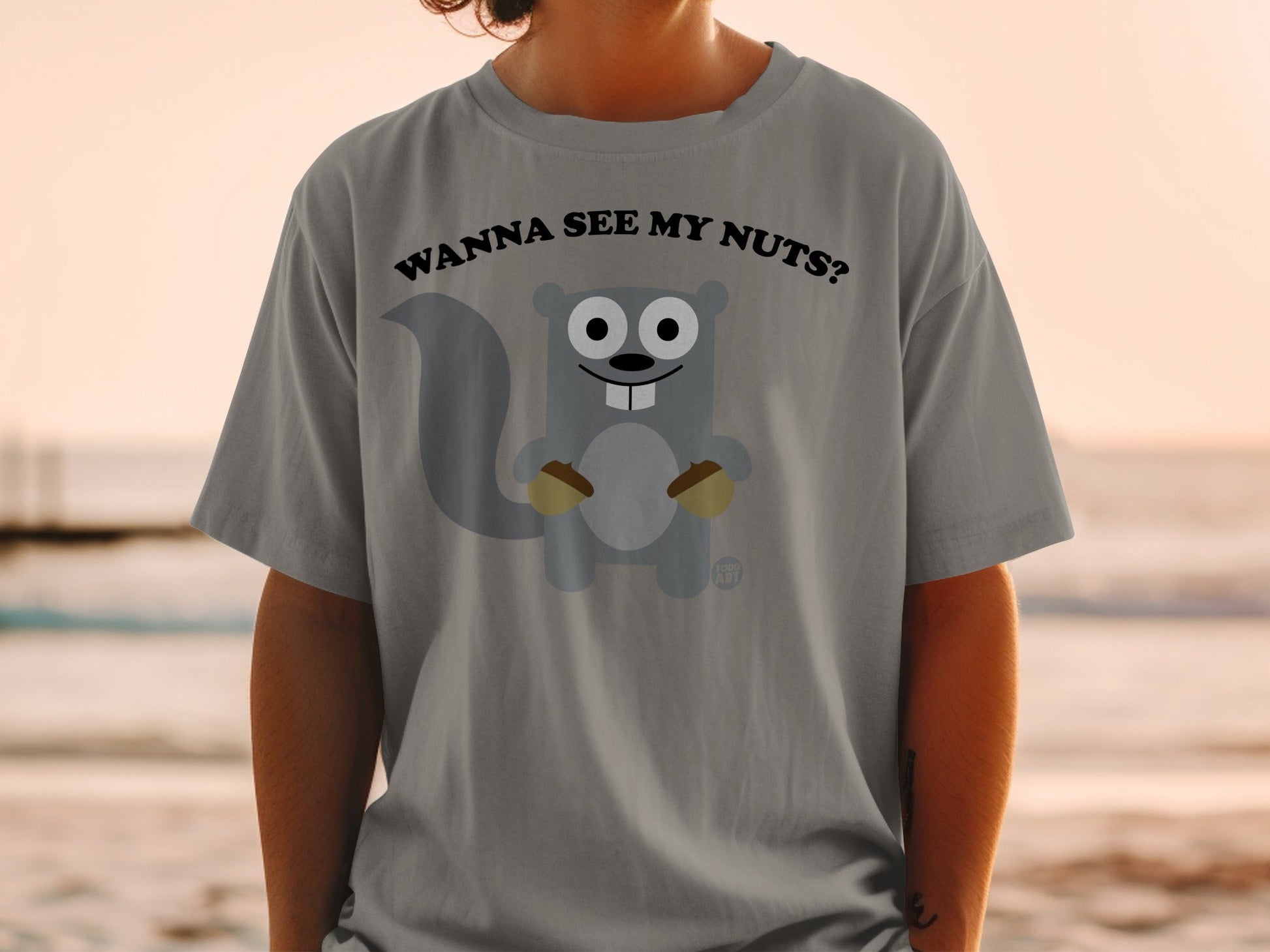 Gray t-shirt with cartoon squirrel asking "Wanna see my nuts?".