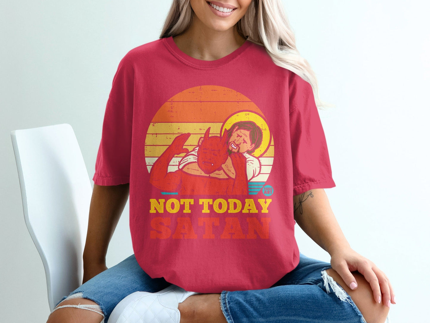 Red t-shirt with graphic of Jesus pushing away a devil with text "NOT TODAY SATAN".