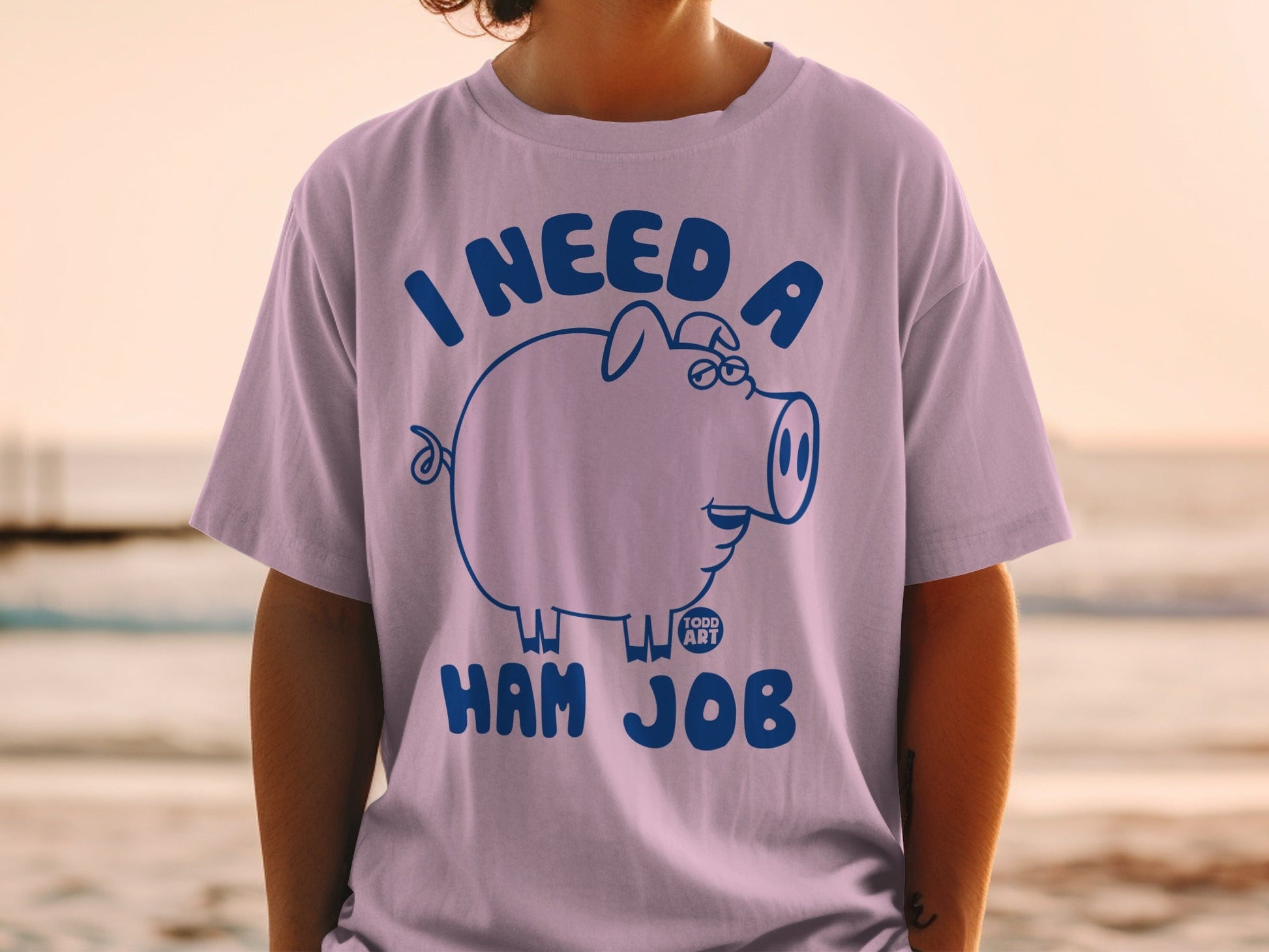 T-shirt with "I need a ham job" text and a cartoon pig.