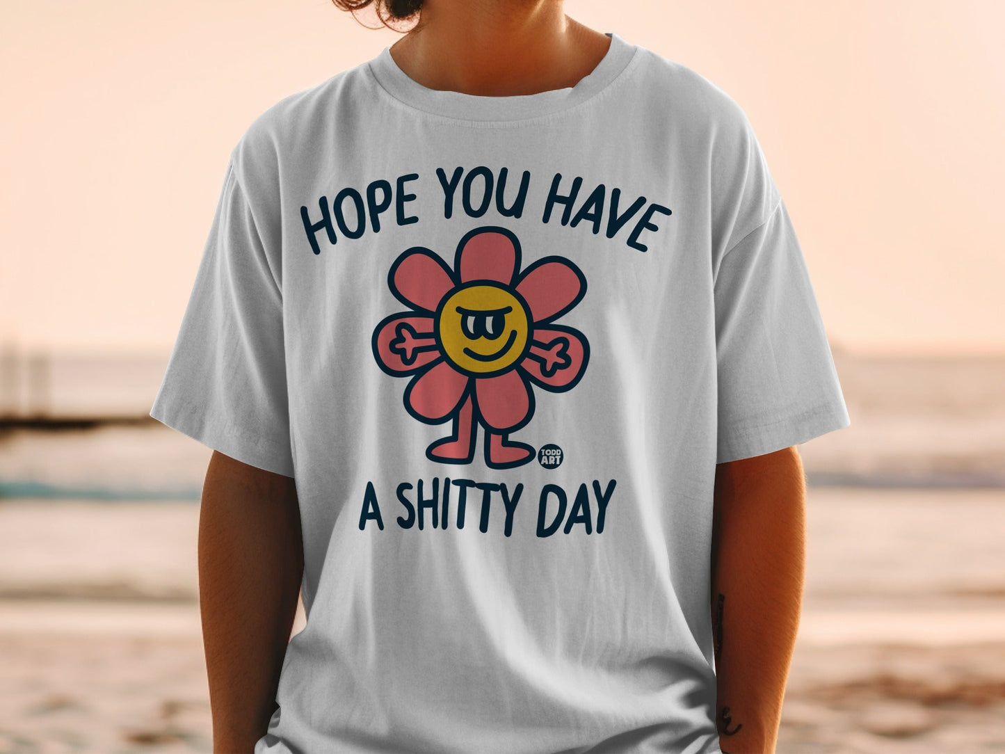 T-shirt with a grumpy flower graphic and "Hope you have a shitty day" text.