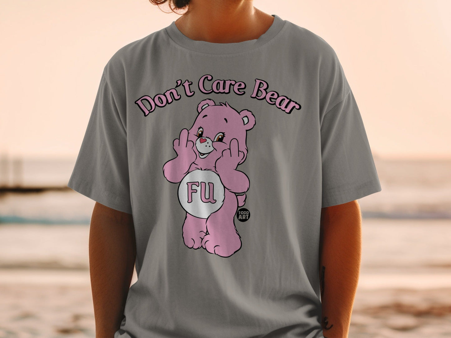 Pink Care Bear t-shirt with "FU" in a heart shape and two middle fingers raised.