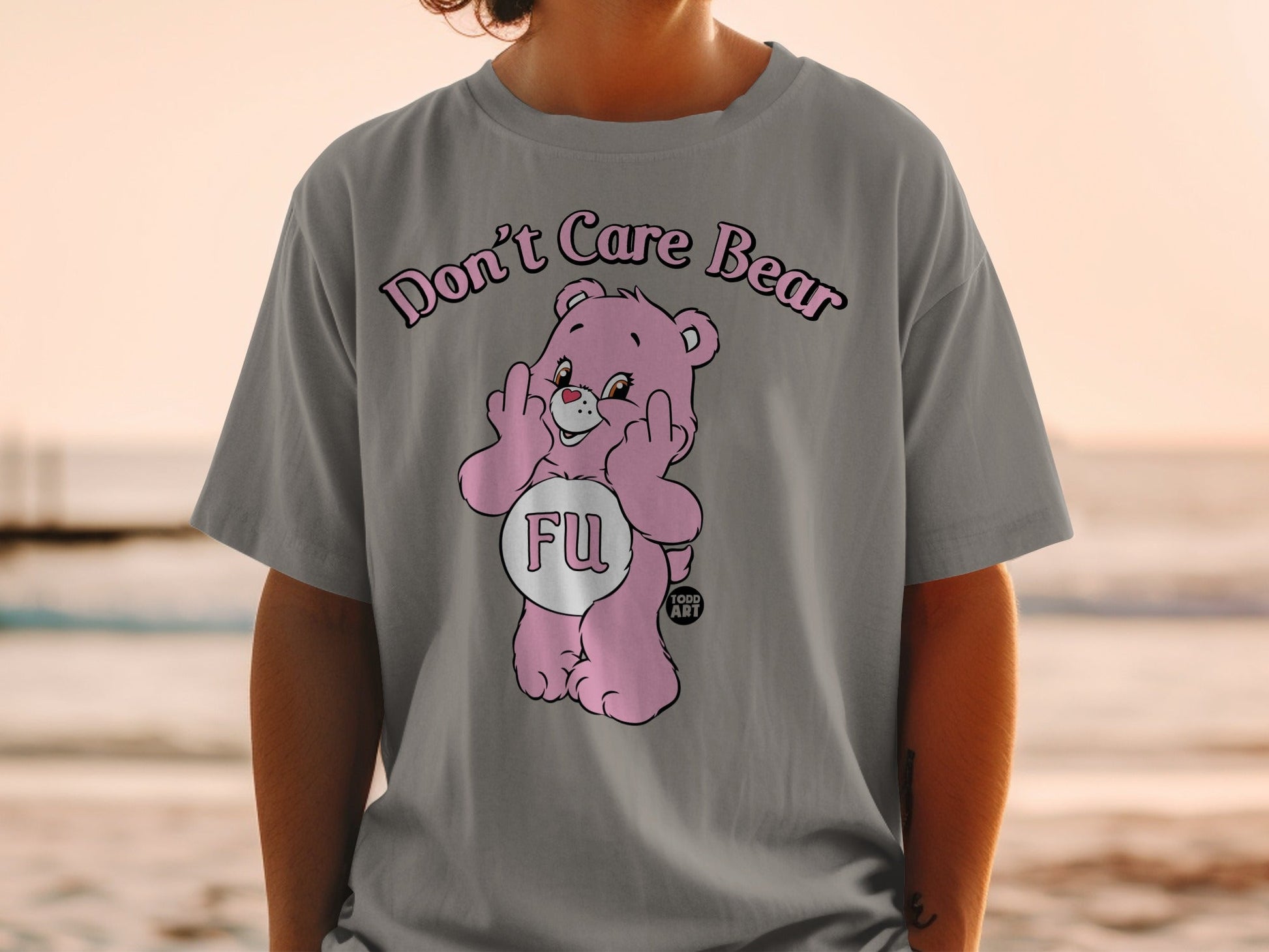 Pink Care Bear t-shirt with "FU" in a heart shape and two middle fingers raised.