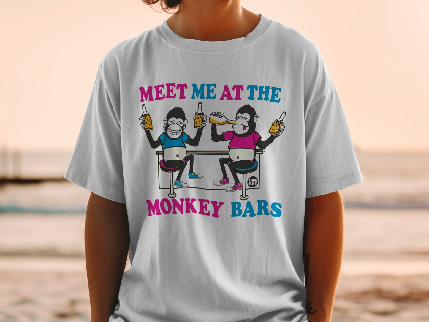 Two cartoon monkeys drinking bottles at bar with "MEET ME AT THE MONKEY BARS" text.