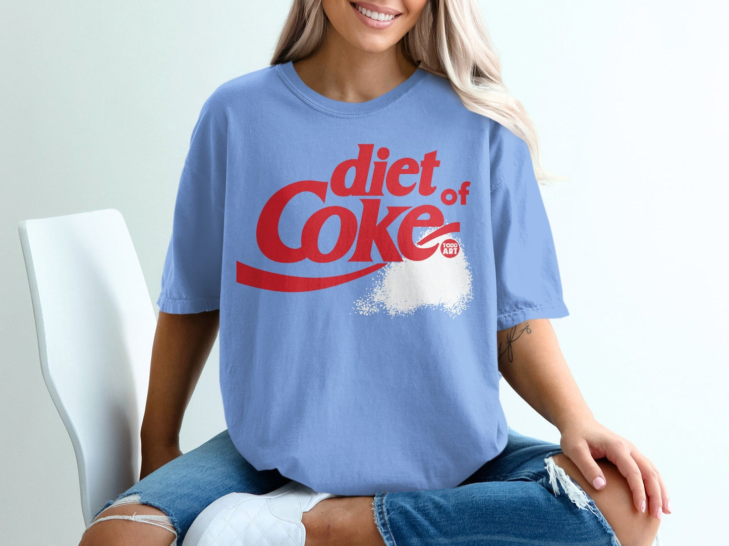 Blue t-shirt with red "diet of Coke" text and a white powder graphic.