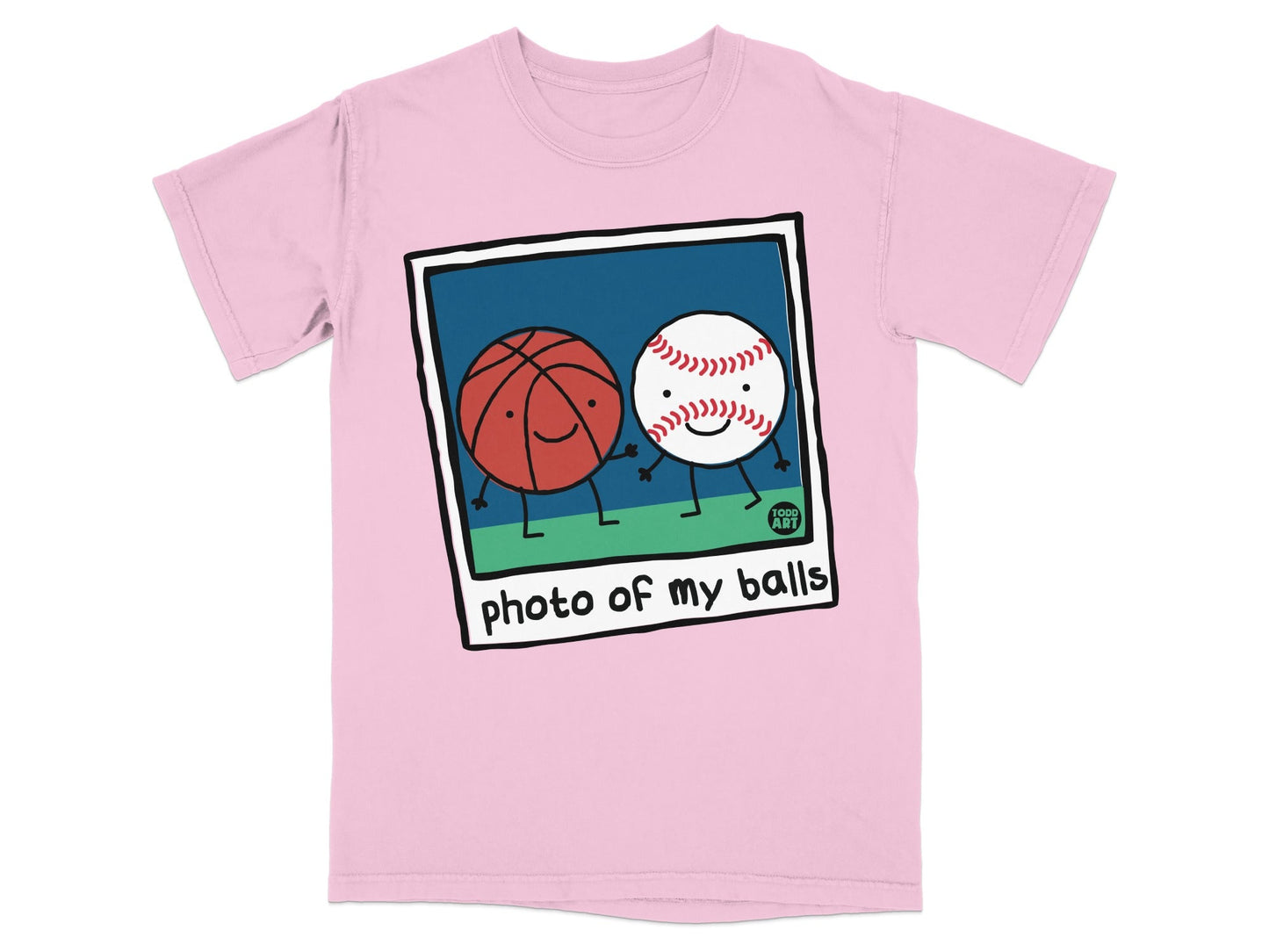 Pink t-shirt featuring a cartoon polaroid of two smiling sports balls.