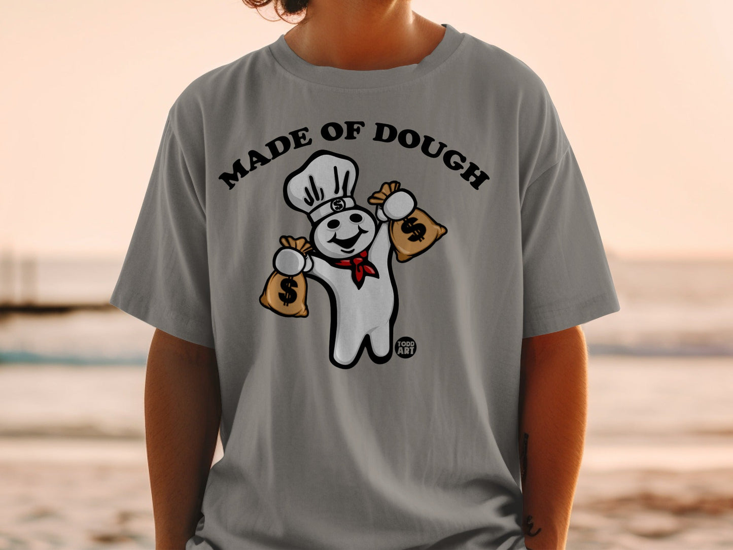Pillsbury Doughboy with chef hat holding money bags, text "MADE OF DOUGH".