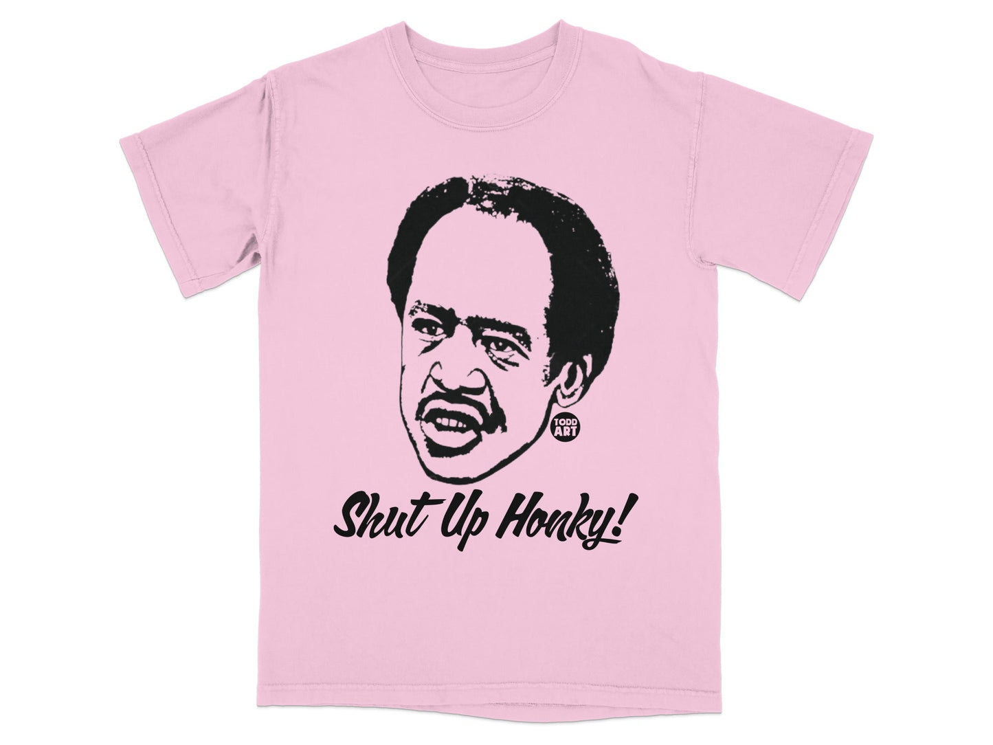 Pink t-shirt with a black illustration of Redd Foxx saying "Shut Up Honky!".
