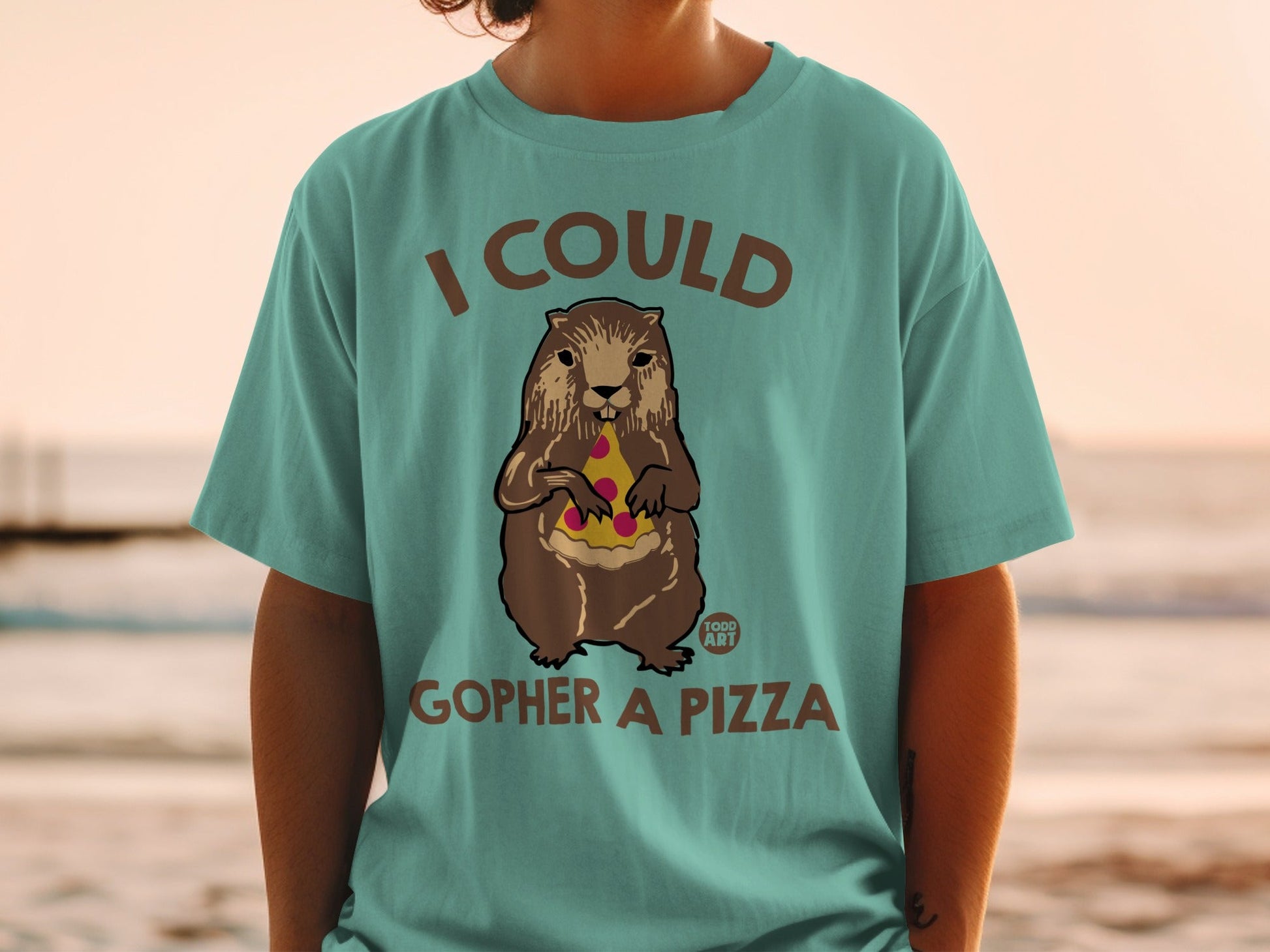 Groundhog eating pizza on t-shirt with "I Could Gopher a Pizza" text.