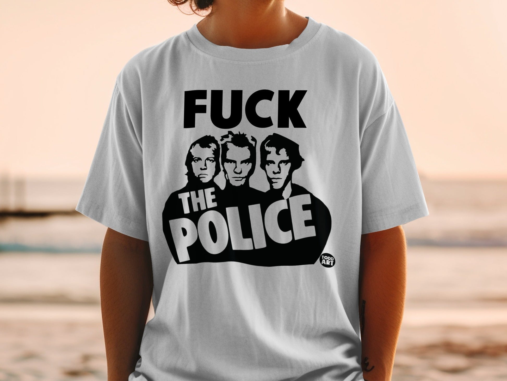 White t-shirt with black graphic of "The Police" band members and text.