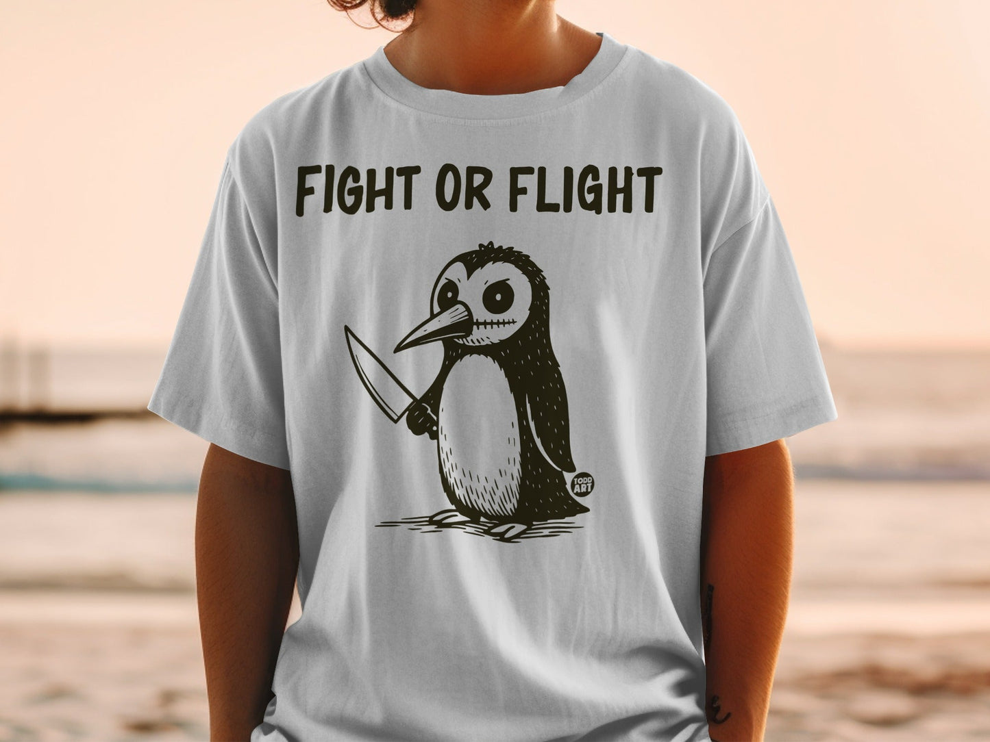 Penguin with knife and "Fight or Flight" text on a t-shirt.