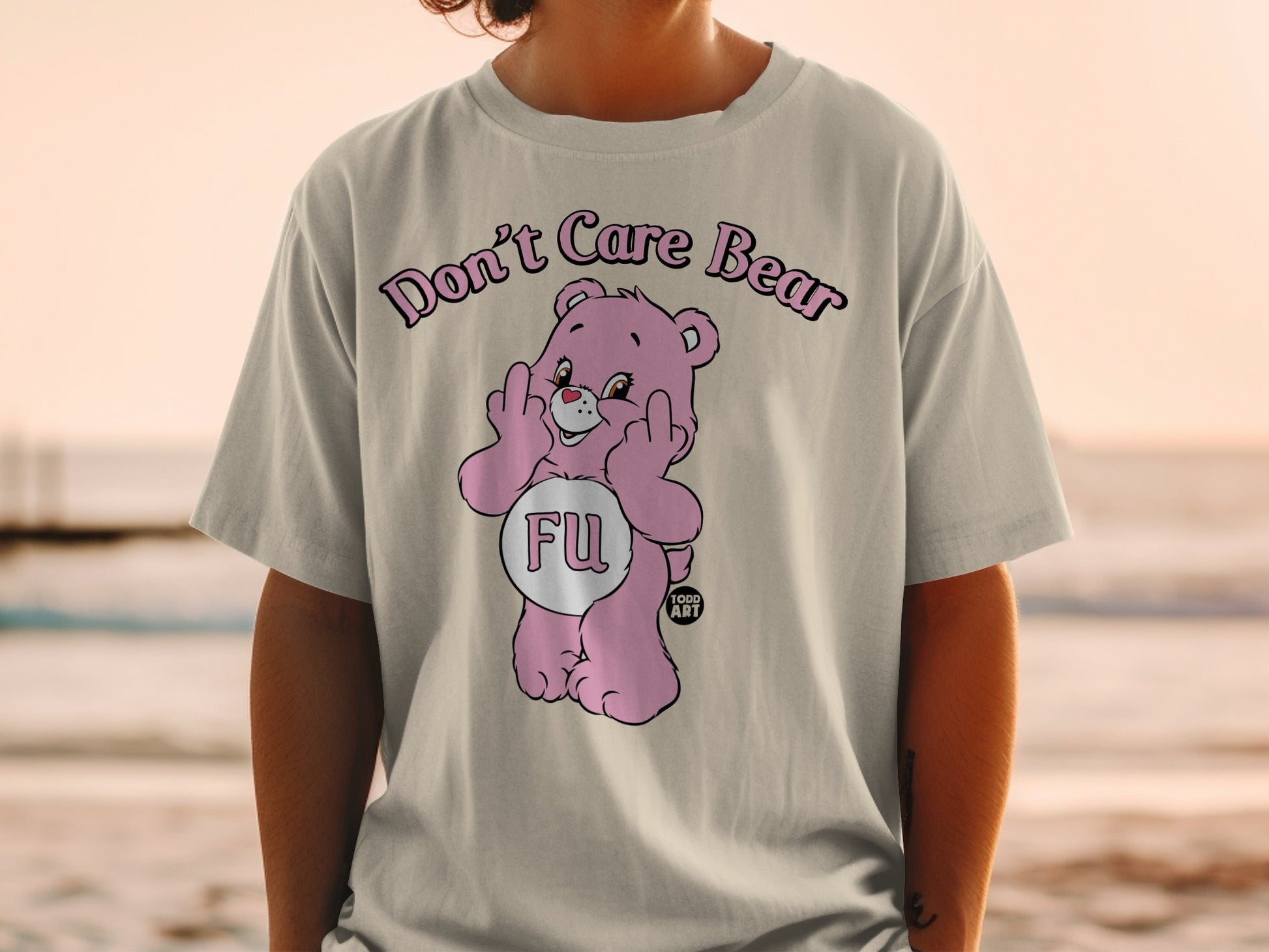 Pink Care Bear t-shirt with "FU" and middle fingers graphic.