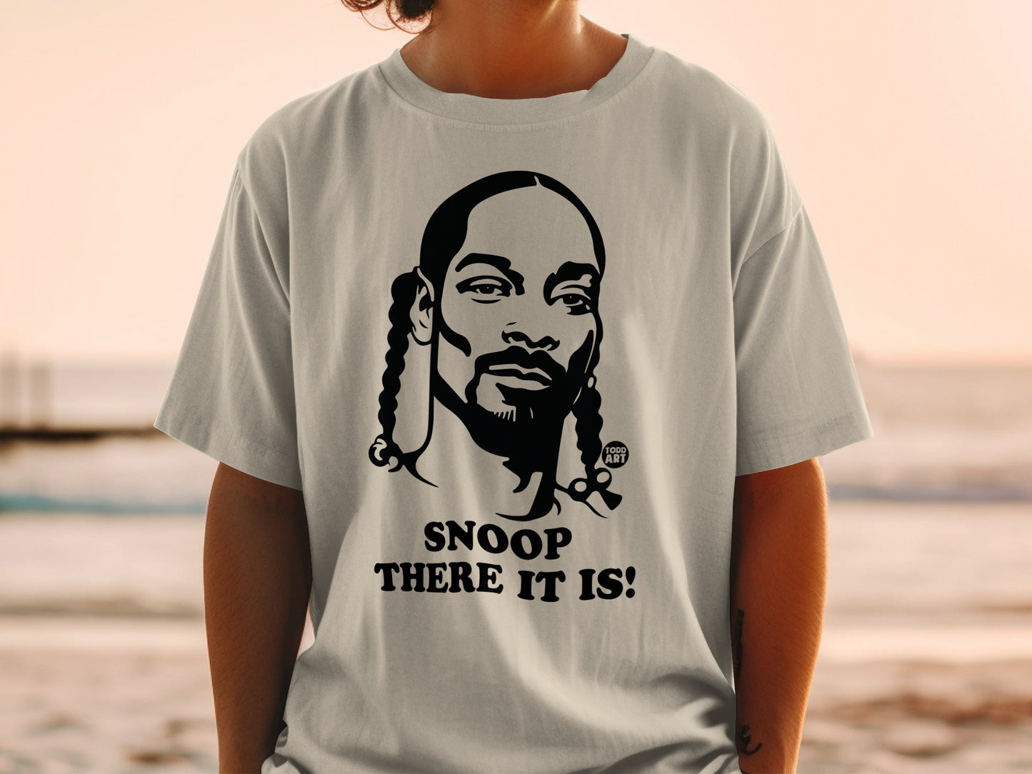 Snoop Dogg graphic t-shirt with text "Snoop There It Is!".