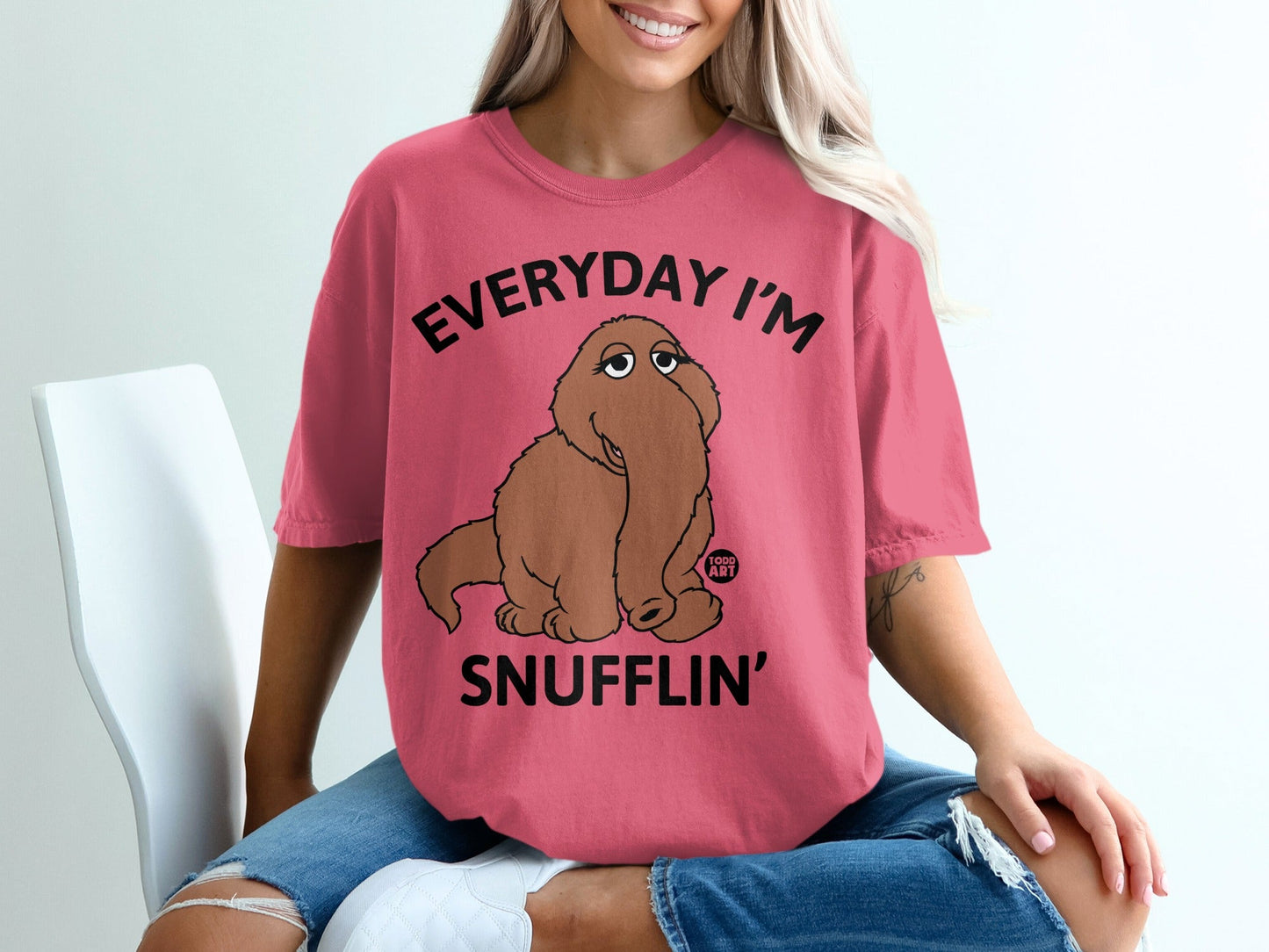 Pink t-shirt with a cartoon elephant and text "EVERYDAY I'M SNUFFLIN'".
