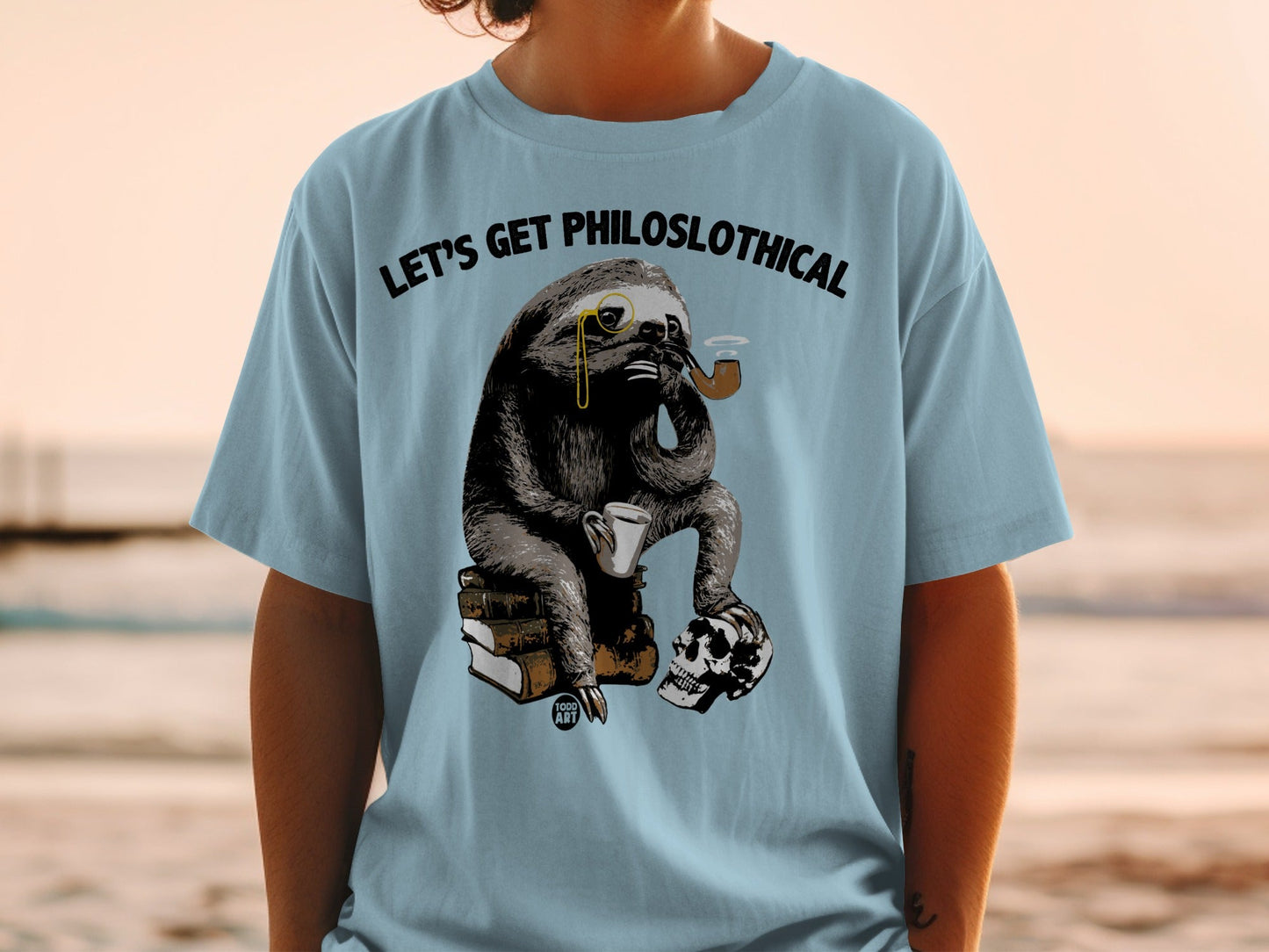 Sloth wearing monocle and smoking pipe, holding coffee cup, sitting on books and skull.