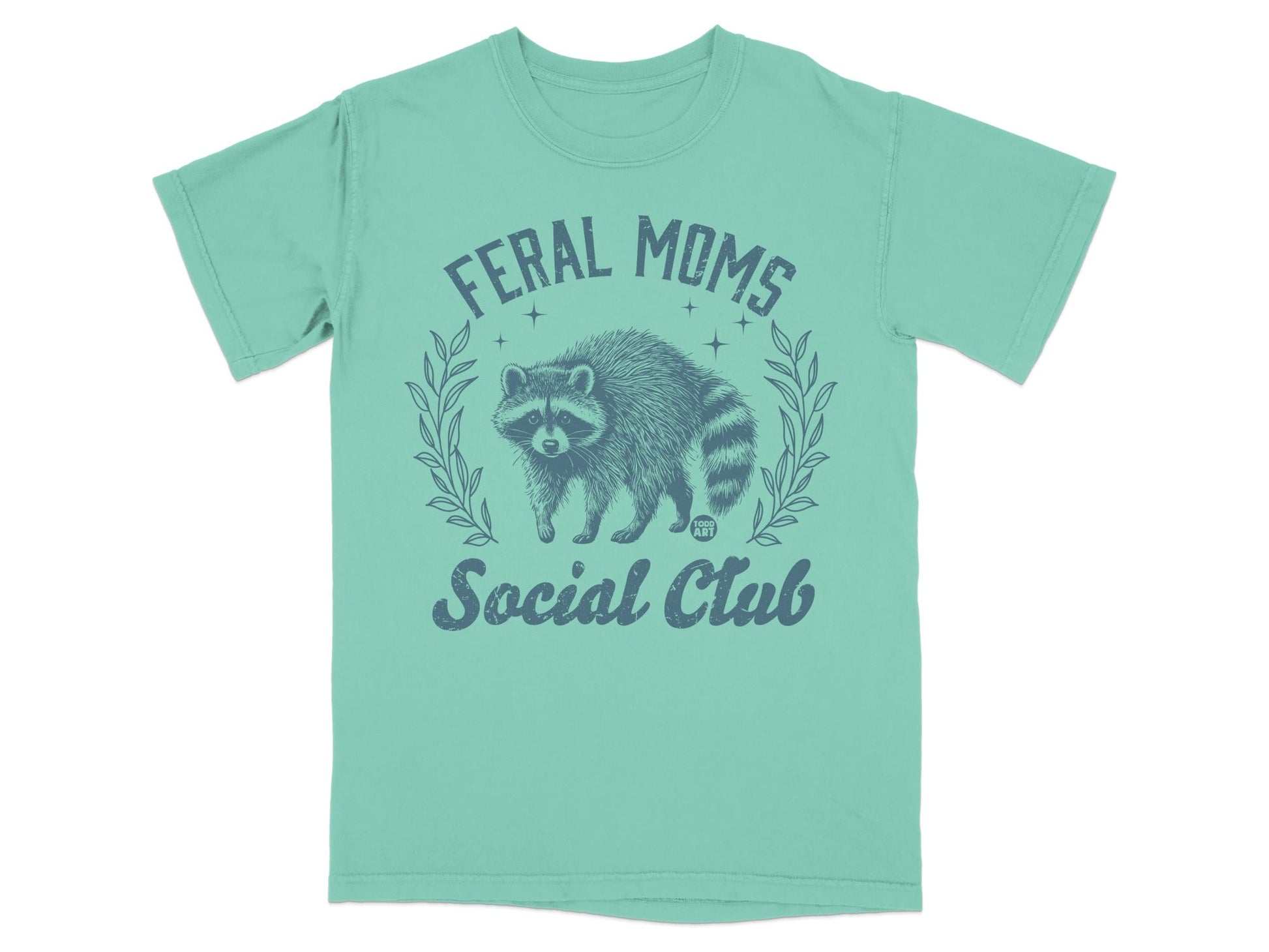 Teal t-shirt with "Feral Moms Social Club" and raccoon illustration.