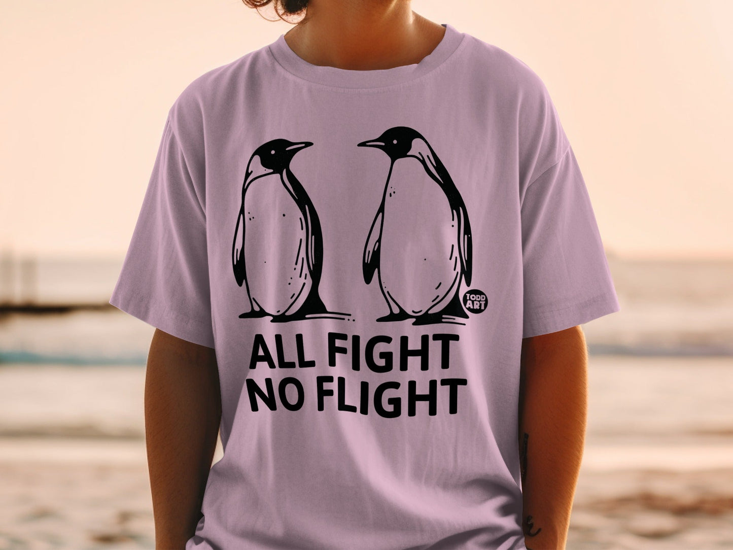 T-shirt with two penguins and text "ALL FIGHT NO FLIGHT".