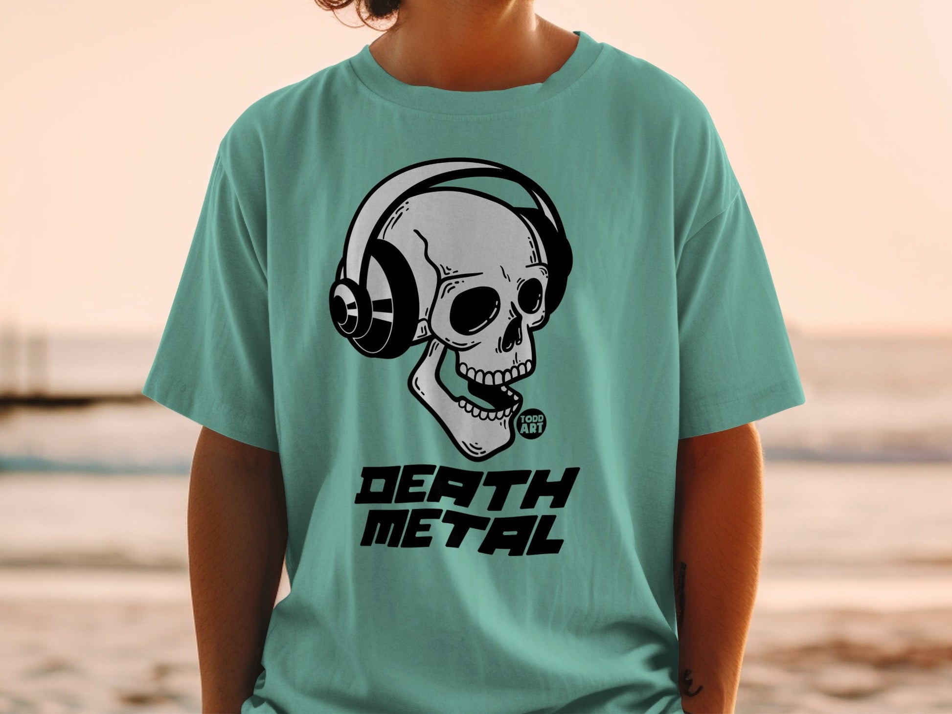 Teal t-shirt with skull wearing headphones and "DEATH METAL" text.