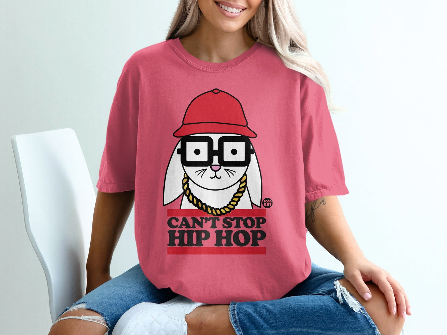 Pink t-shirt with cartoon bunny wearing glasses and "Can't Stop Hip Hop" text.