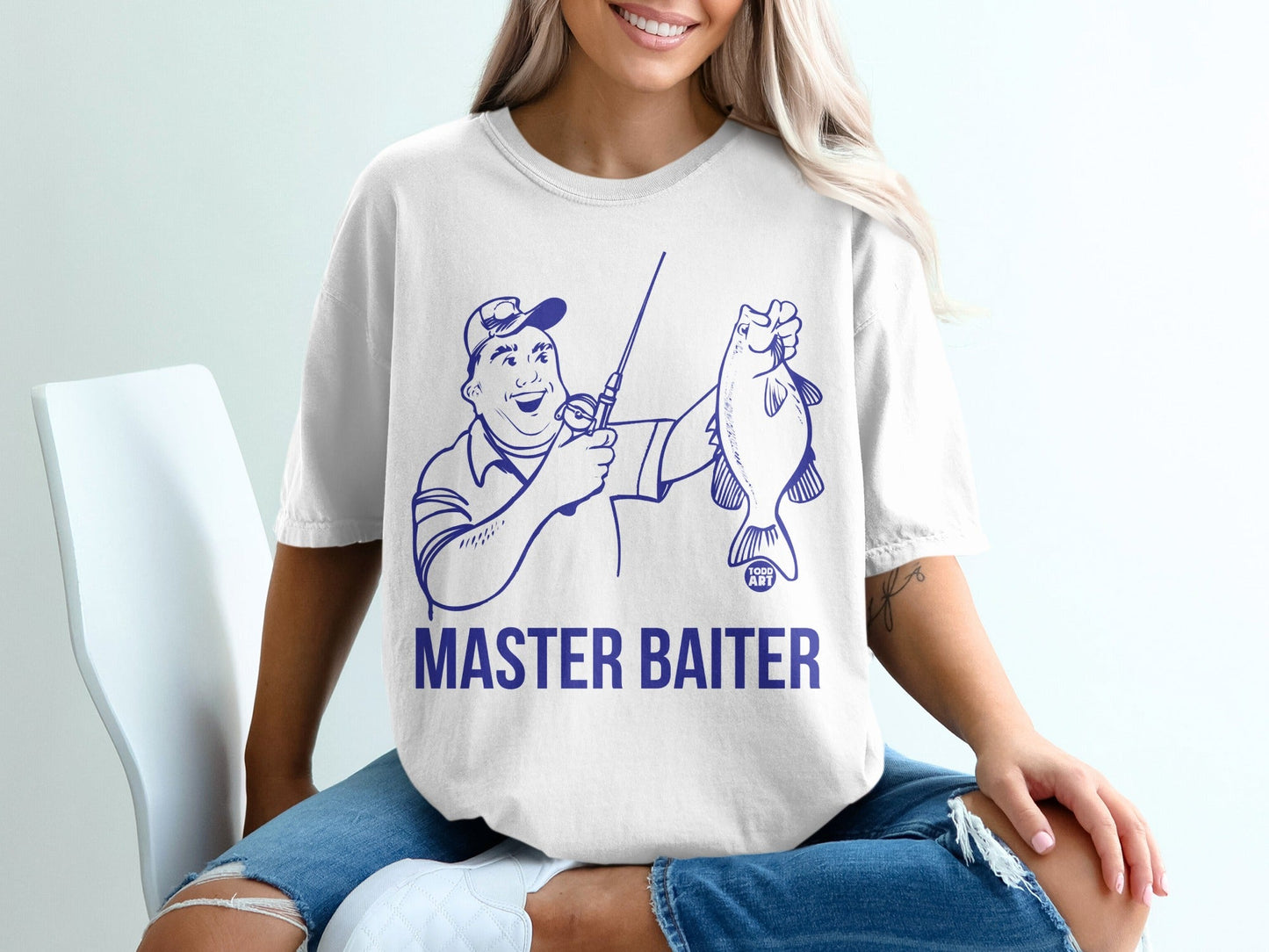T-shirt with blue graphic of a fisherman holding a fish and text "MASTER BAITER".