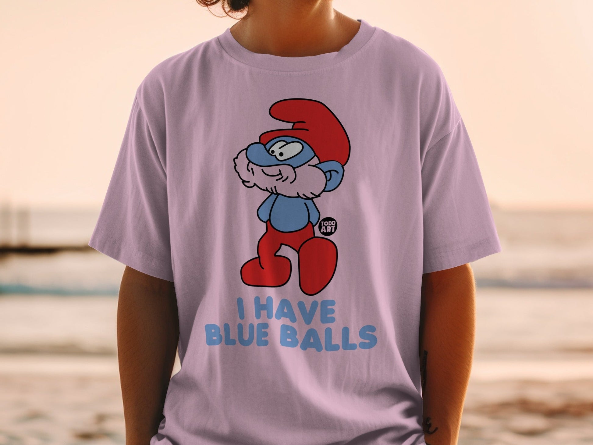 Smurf wearing red shoes and hat, saying "I have blue balls."