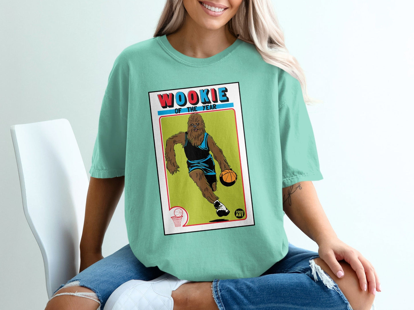 Wookiee of the Year basketball card graphic on a teal t-shirt.