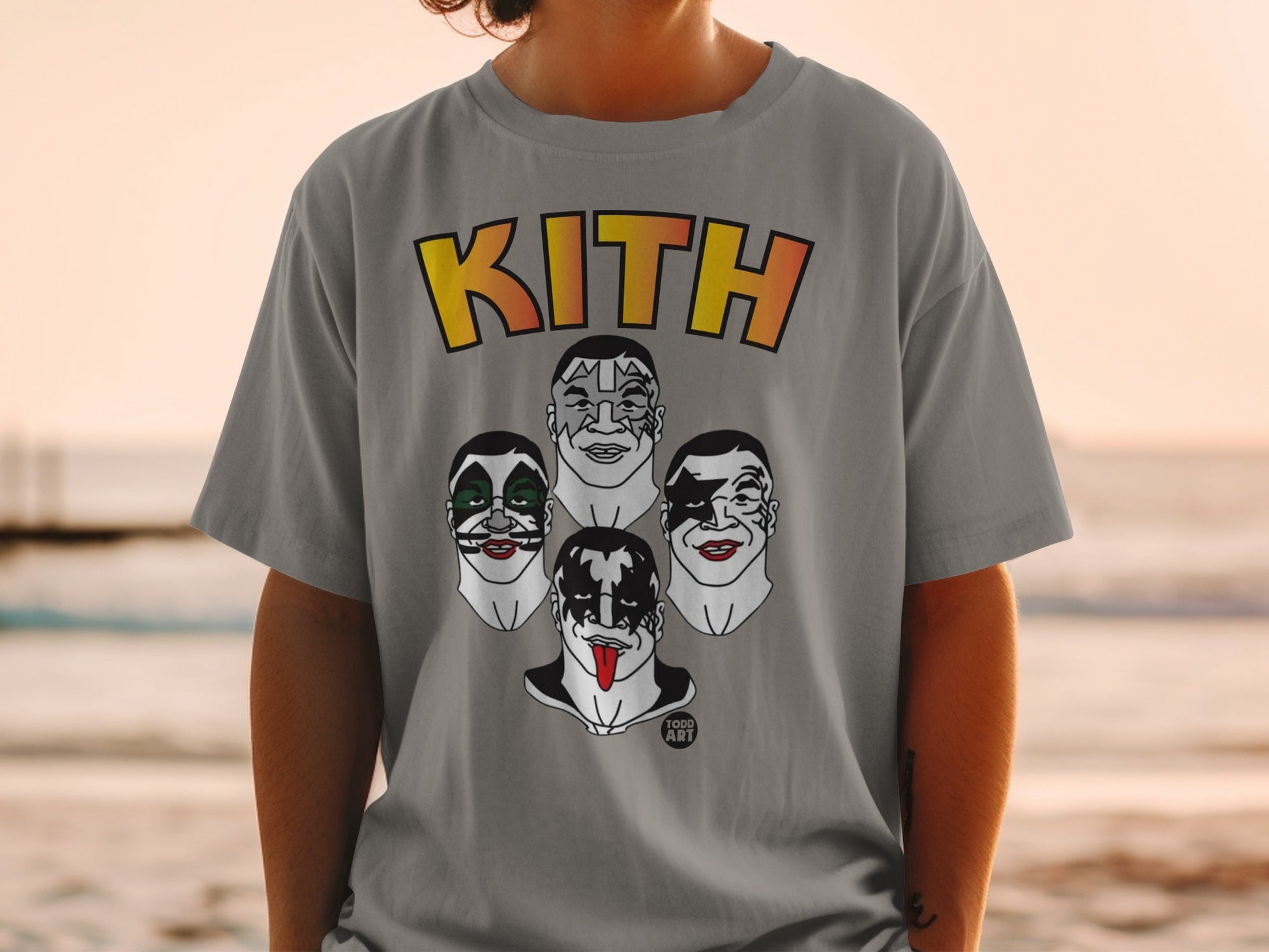 Kith t-shirt with cartoon faces of KISS band members on a beach.