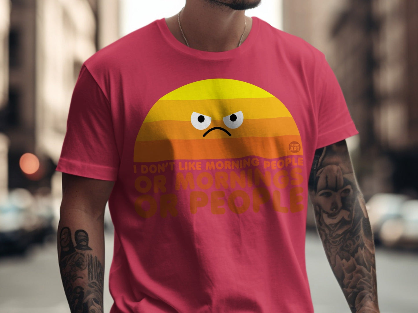 Crimson t-shirt with grumpy sun graphic and text.
