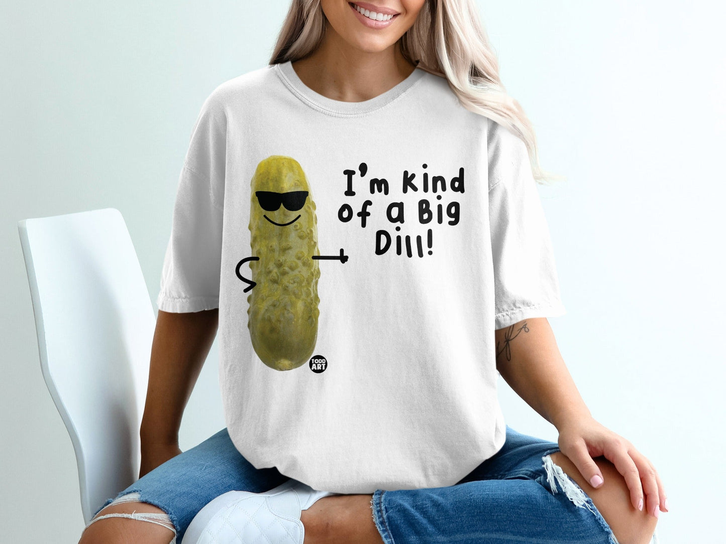 White t-shirt with cartoon pickle wearing sunglasses saying "I'm kind of a Big Dill!"