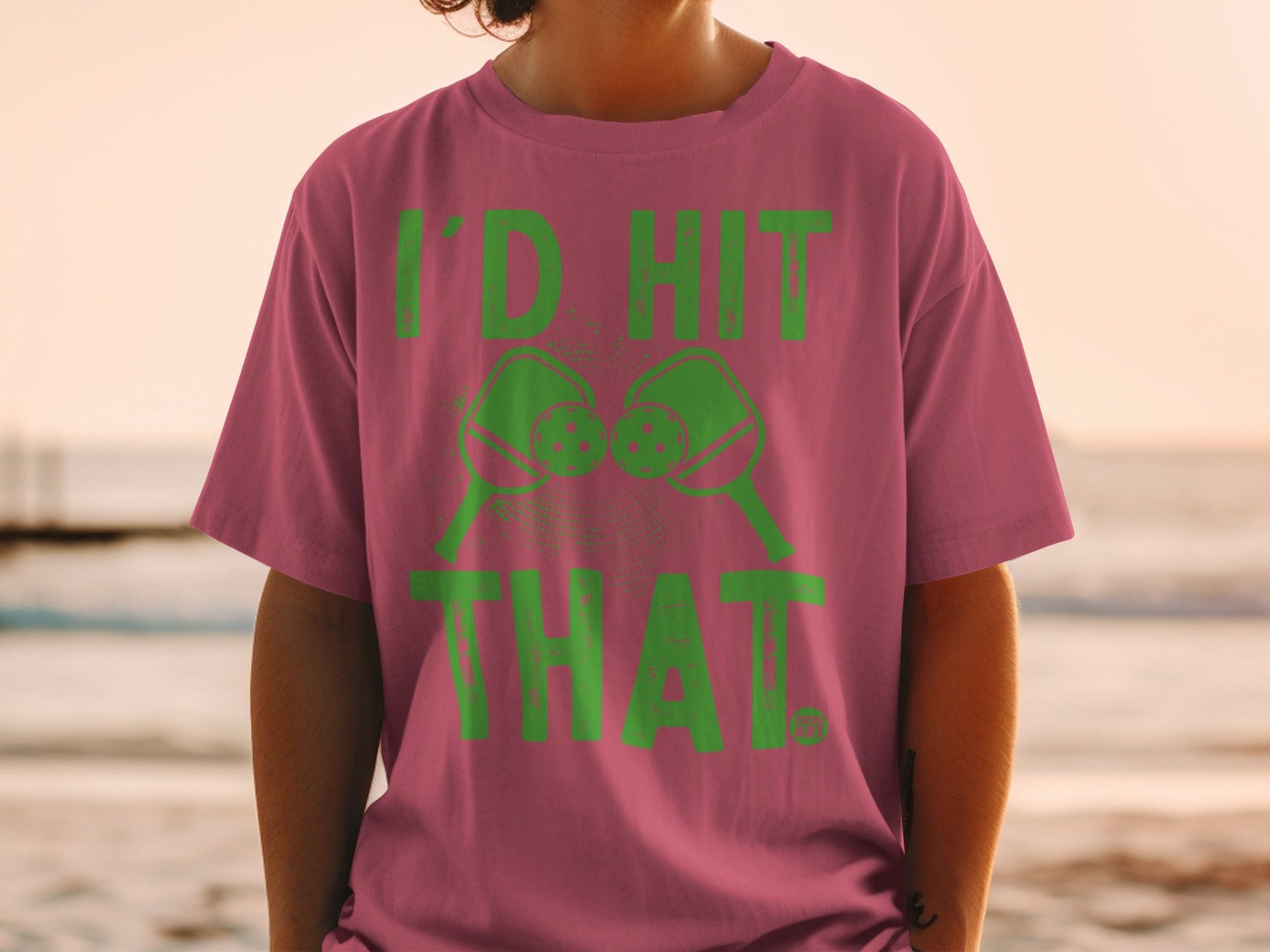 Pink t-shirt with green text and pickleball paddles saying "I'D HIT THAT."