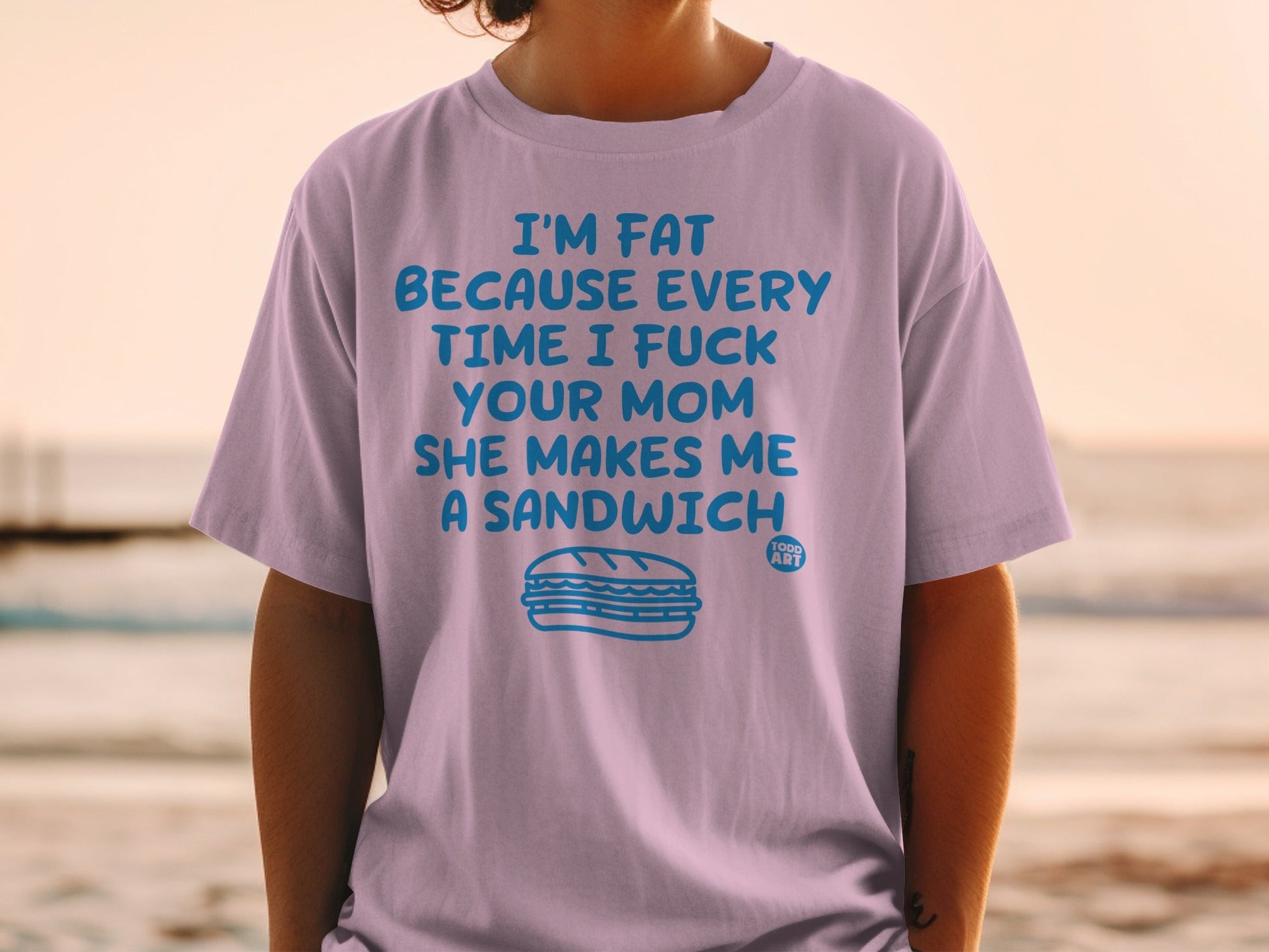 Lilac t-shirt with a sandwich graphic and humorous text.
