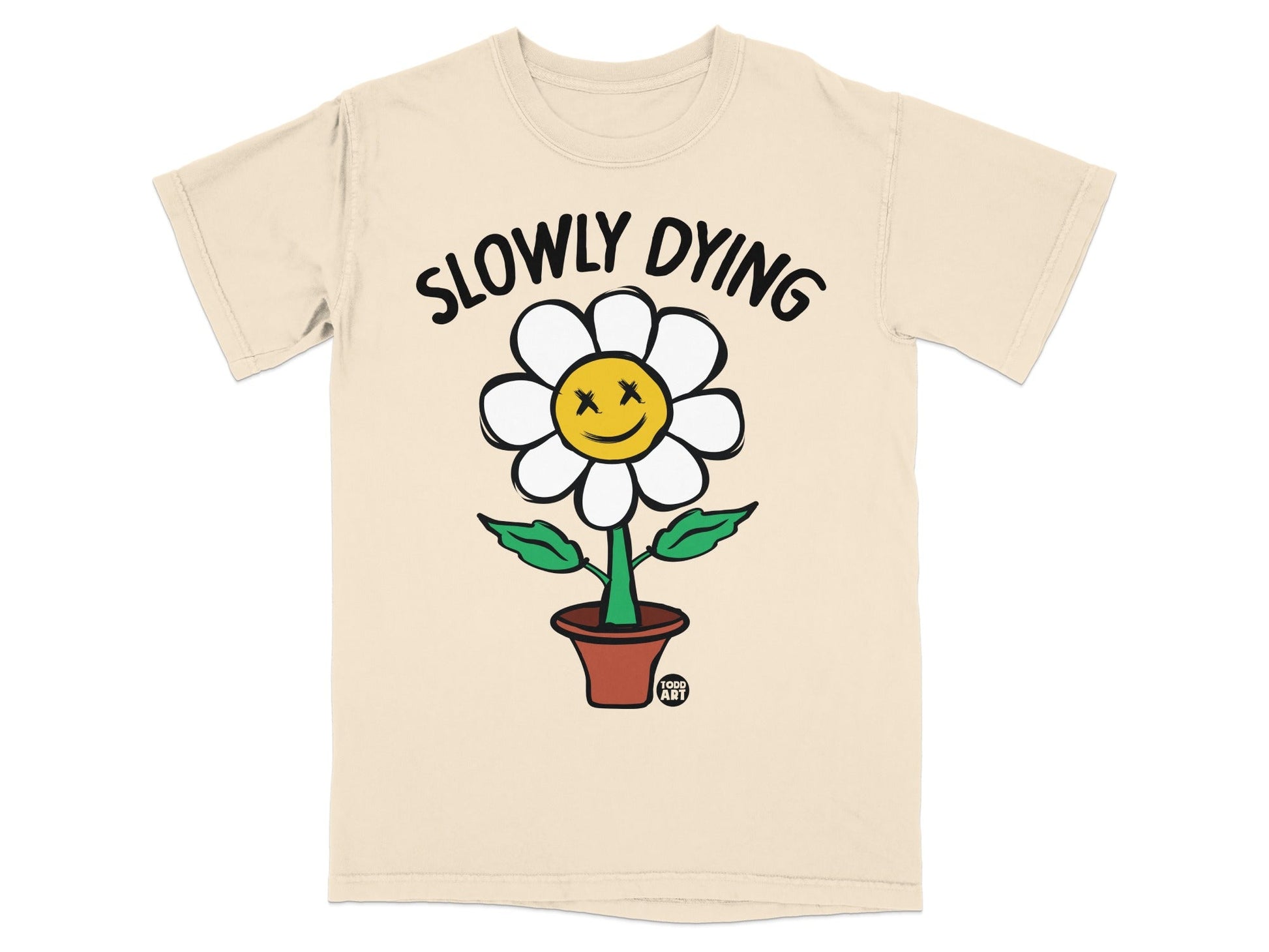 Beige t-shirt with a smiling flower labeled "SLOWLY DYING" and "TODO ART".
