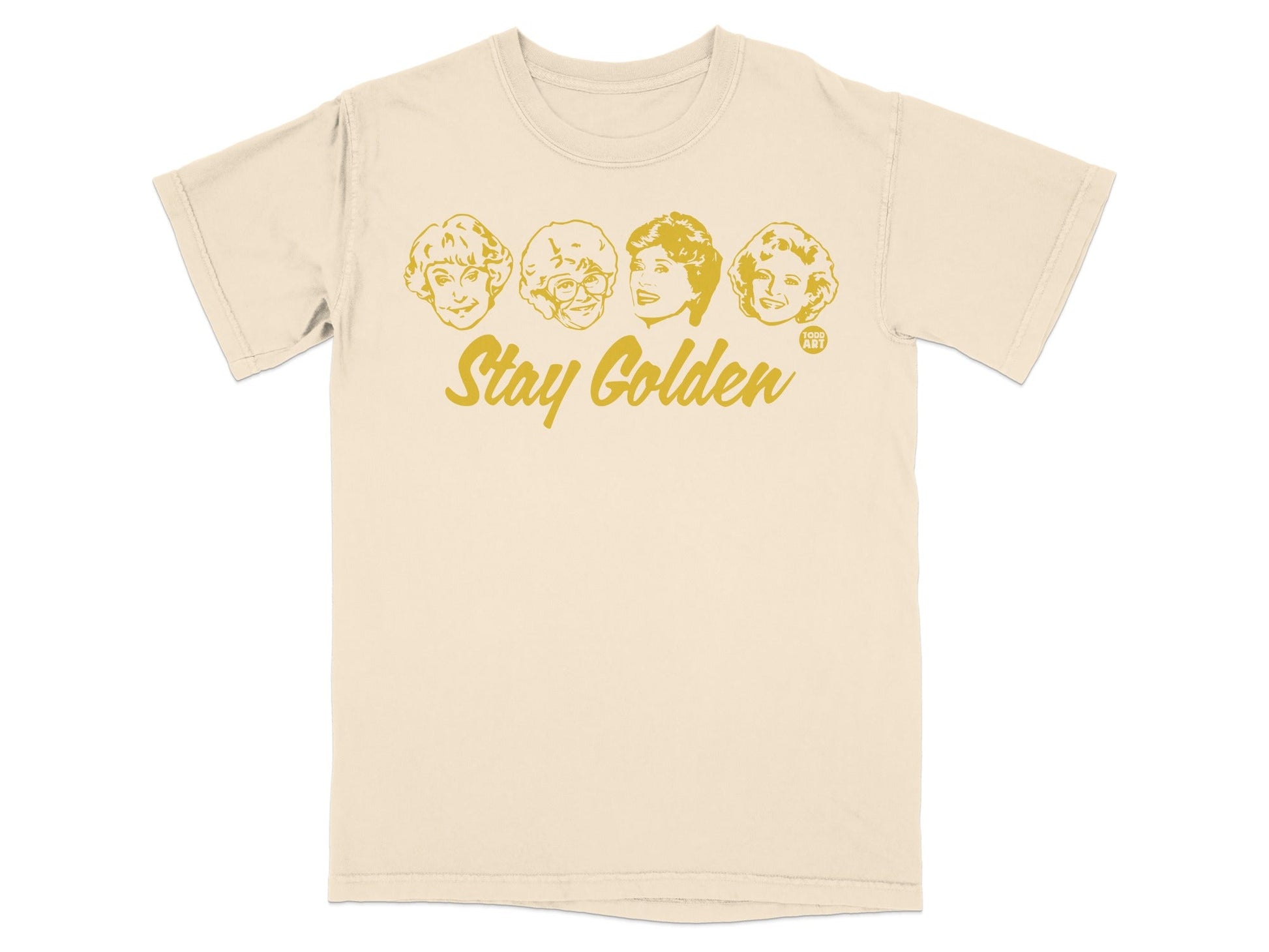 Cream t-shirt with "Stay Golden" and four cartoon faces of The Golden Girls.