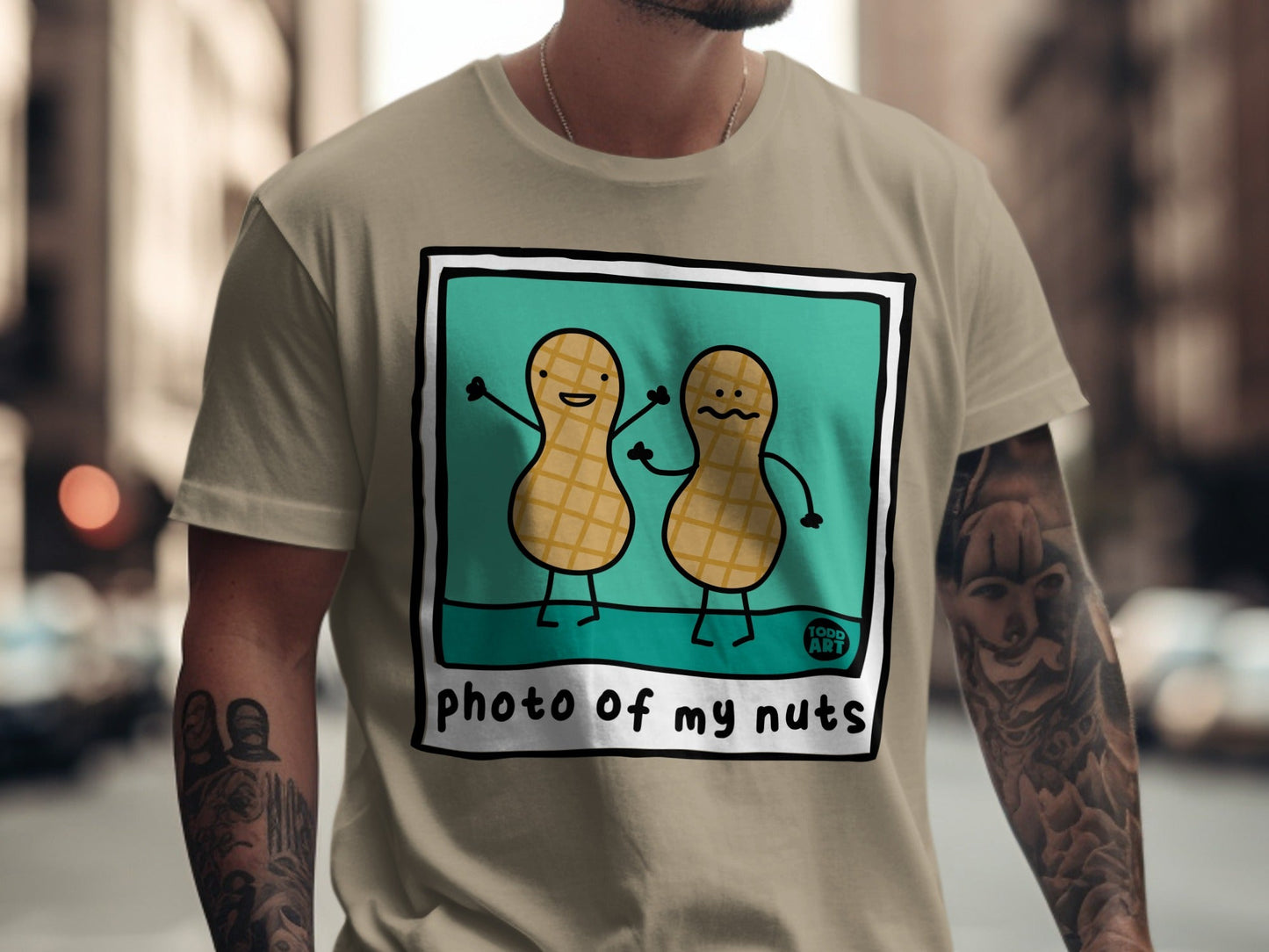 Two cartoon peanuts with arms and legs, text reads "photo of my nuts."