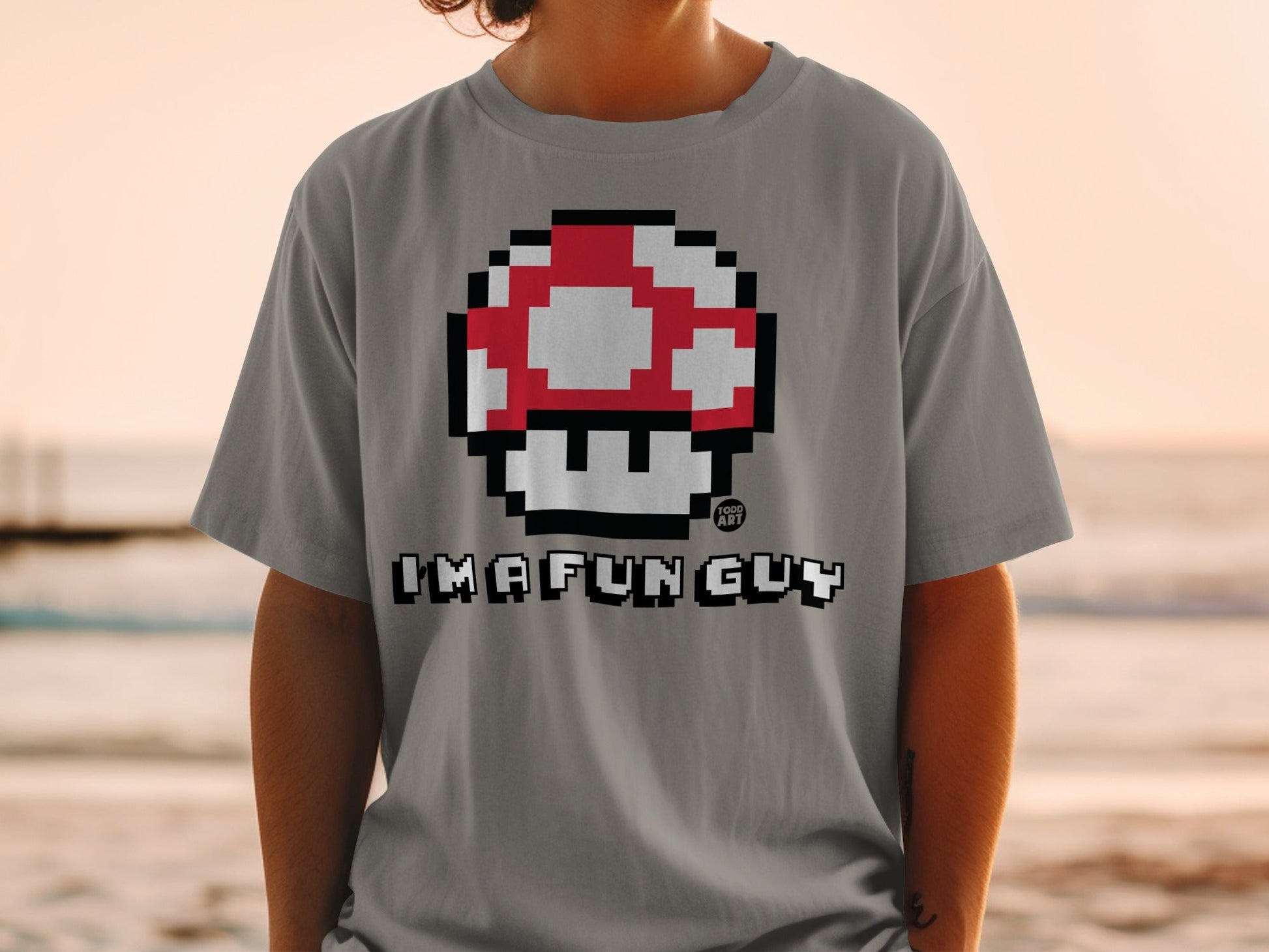 Gray t-shirt with Super Mario mushroom design and "I'm a fun guy" text.