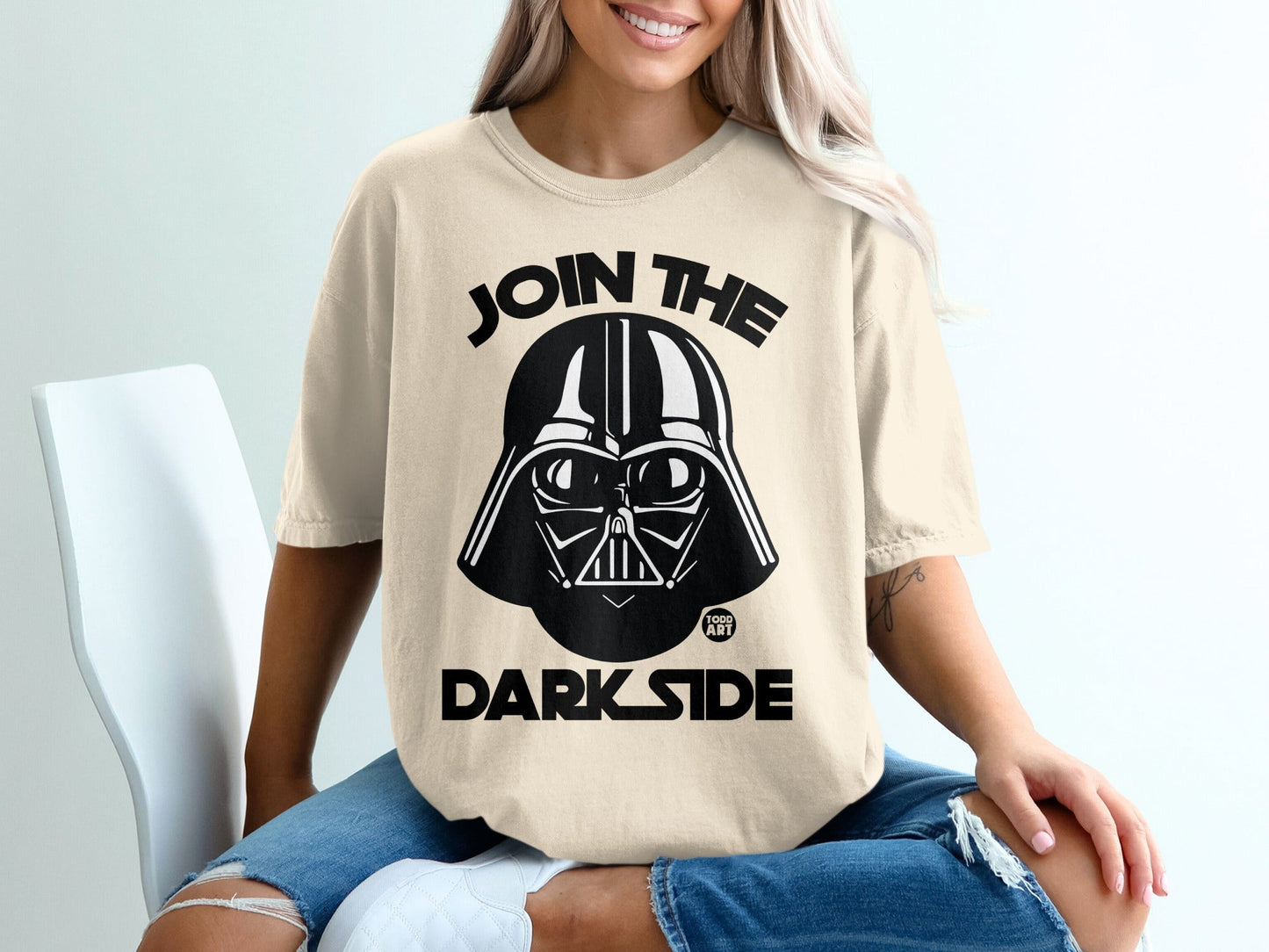 Darth Vader helmet graphic with text "JOIN THE DARK SIDE" on a cream t-shirt.