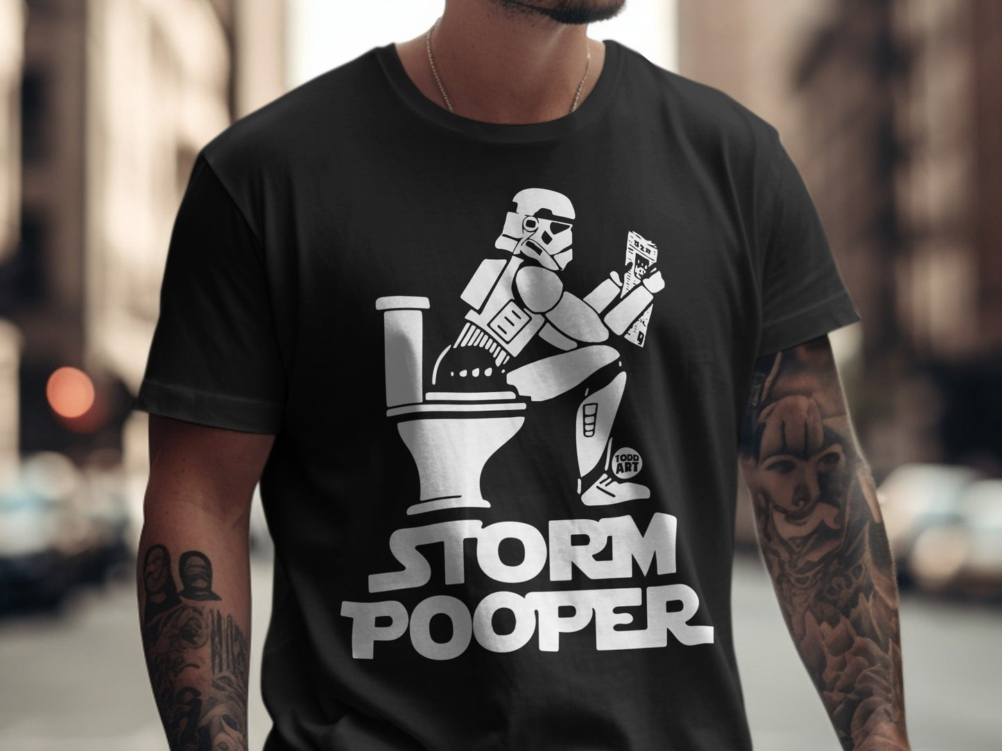 Black t-shirt with "Storm Pooper" text and Stormtrooper on toilet design.