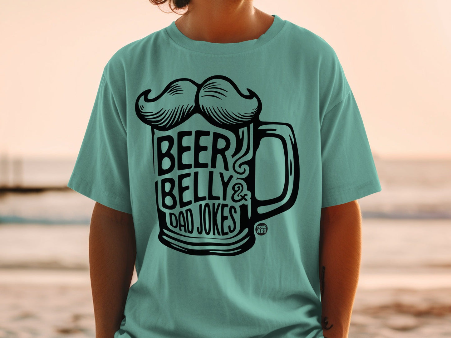 Teal t-shirt with "Beer Belly & Dad Jokes" text and a beer mug graphic.