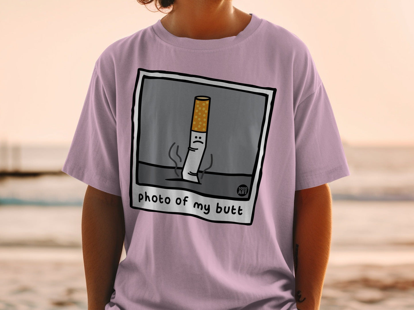 T-shirt with cartoon cigarette that says "photo of my butt."