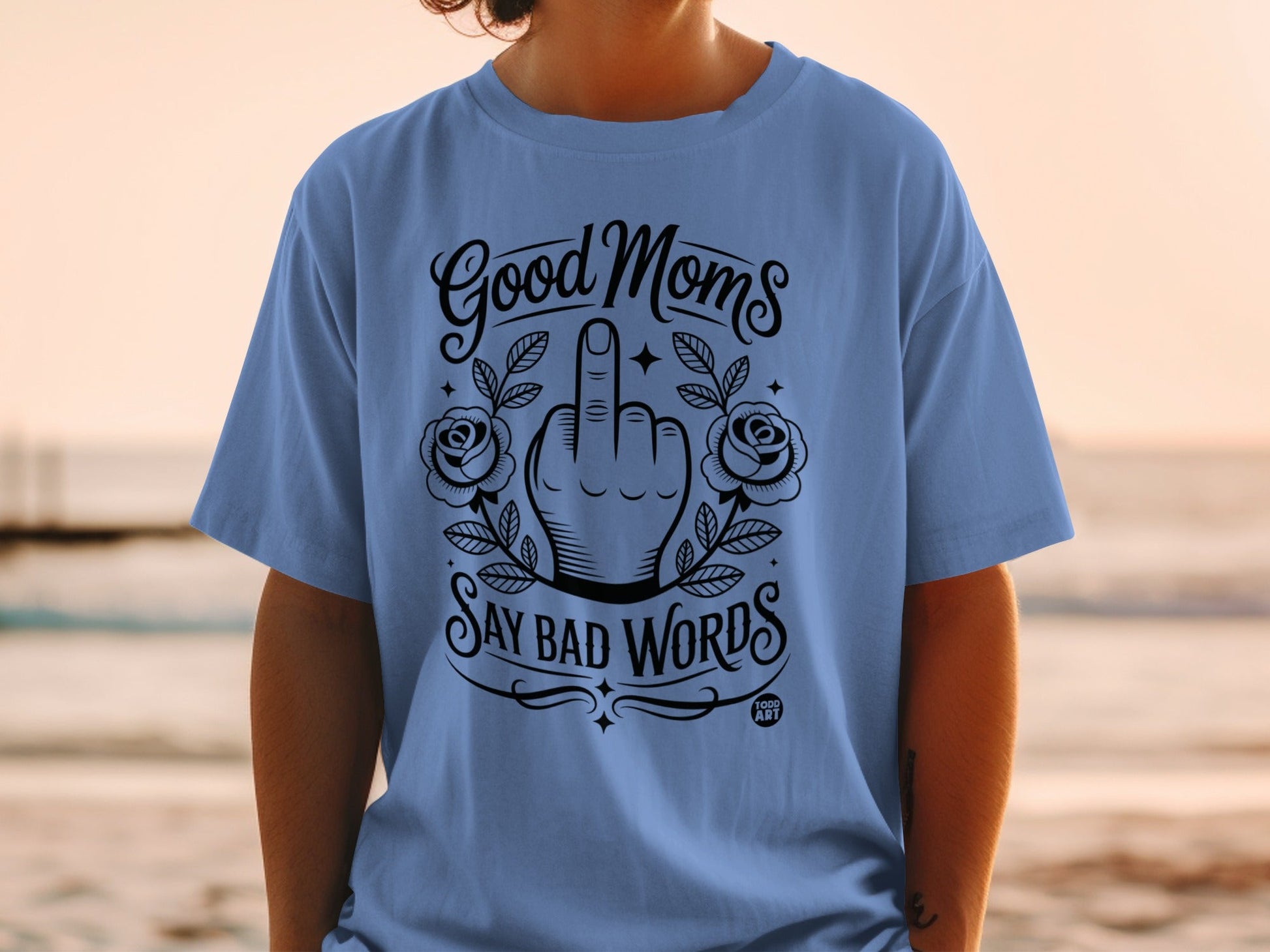Blue t-shirt with "Good Moms Say Bad Words" and a middle finger graphic.