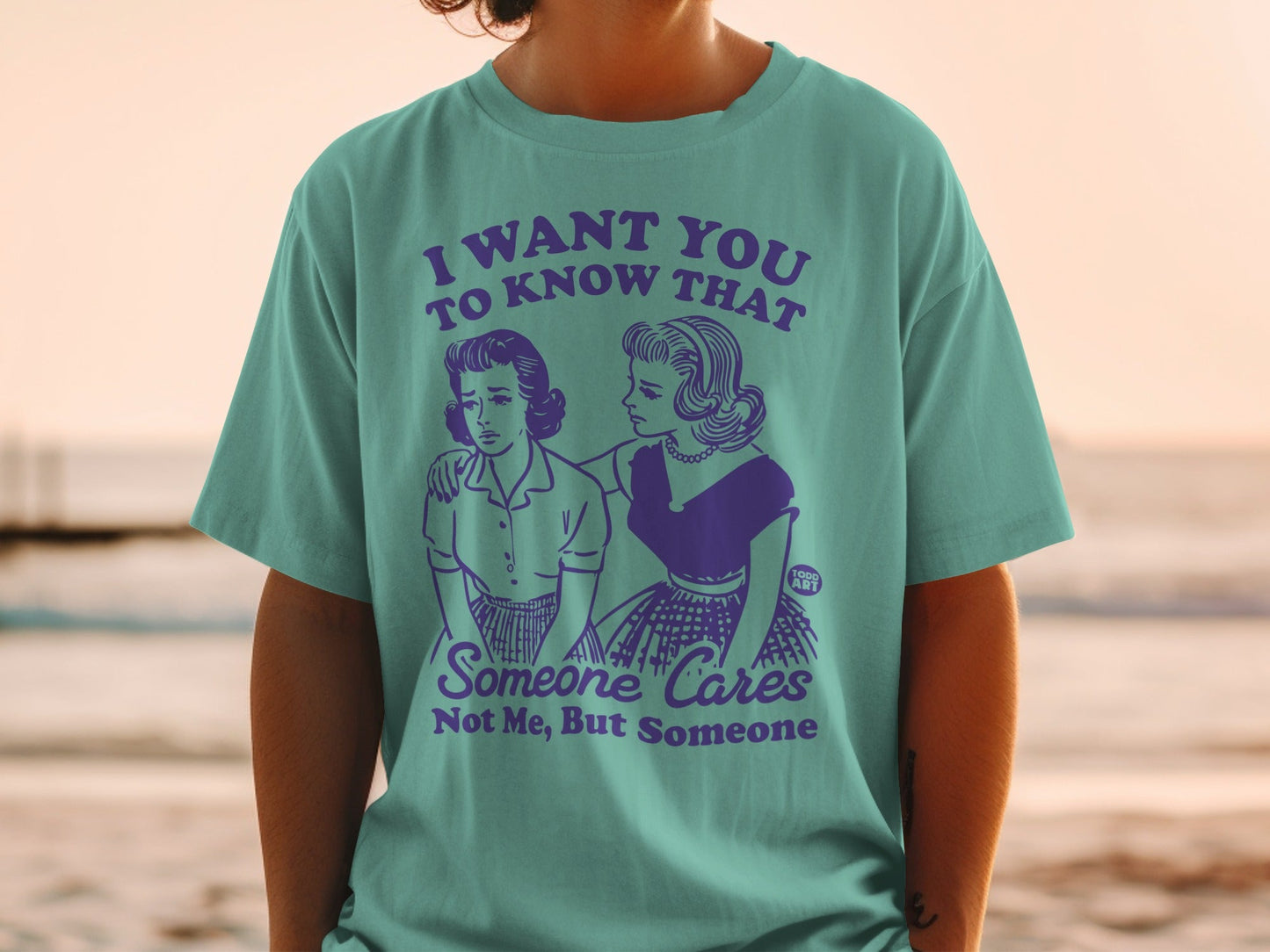 T-shirt with vintage cartoon illustration and text about caring.