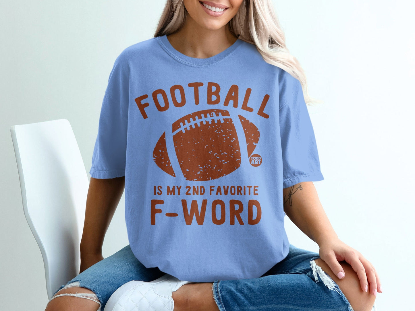 Blue t-shirt with "FOOTBALL IS MY 2ND FAVORITE F-WORD" text and football graphic.