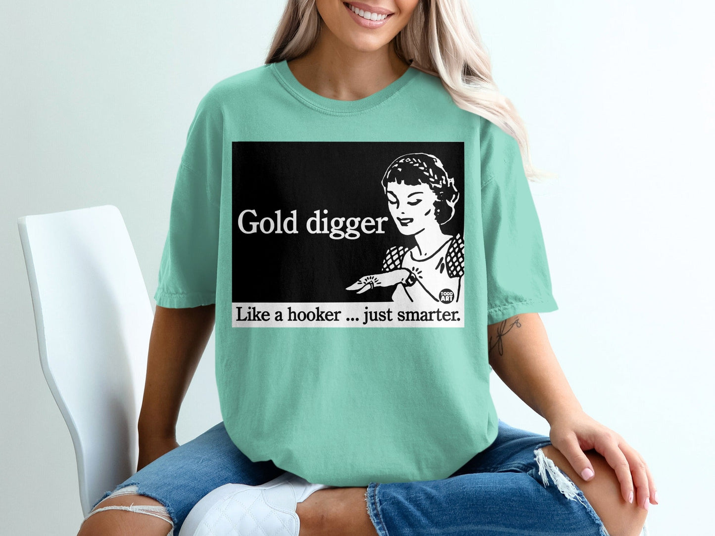 Mint t-shirt with "Gold digger. Like a hooker...just smarter." slogan and retro illustration.